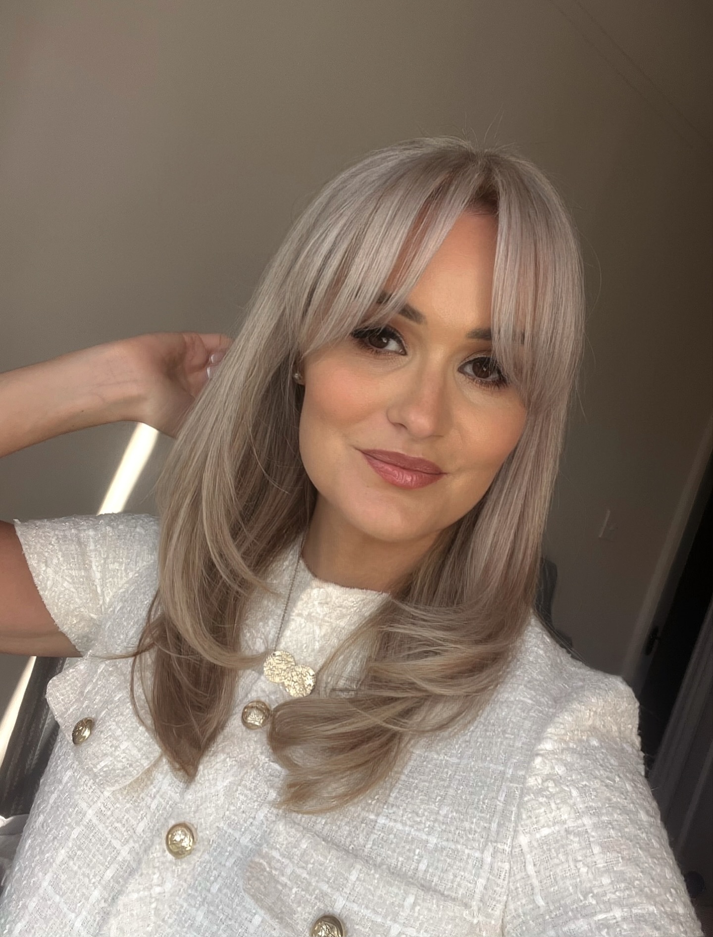 Sleek Silver Layered Cut with Soft Blunt Bangs