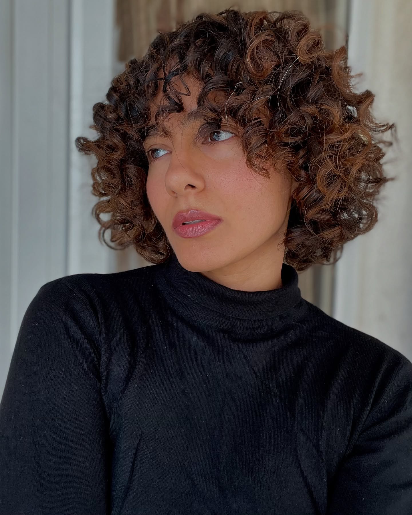Chic Curly Bob with Soft Face-Framing Layers