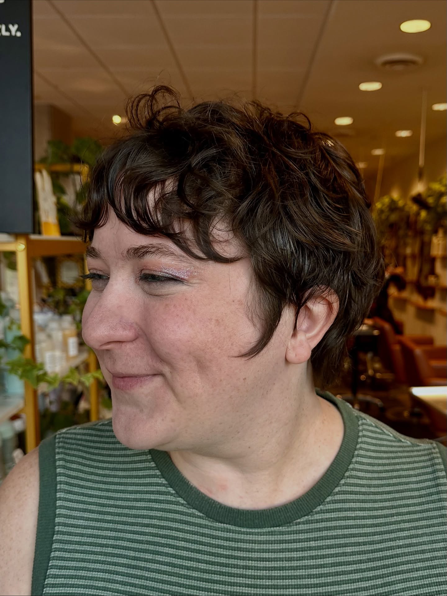 Chic Curly Brown Pixie with Defined Texture