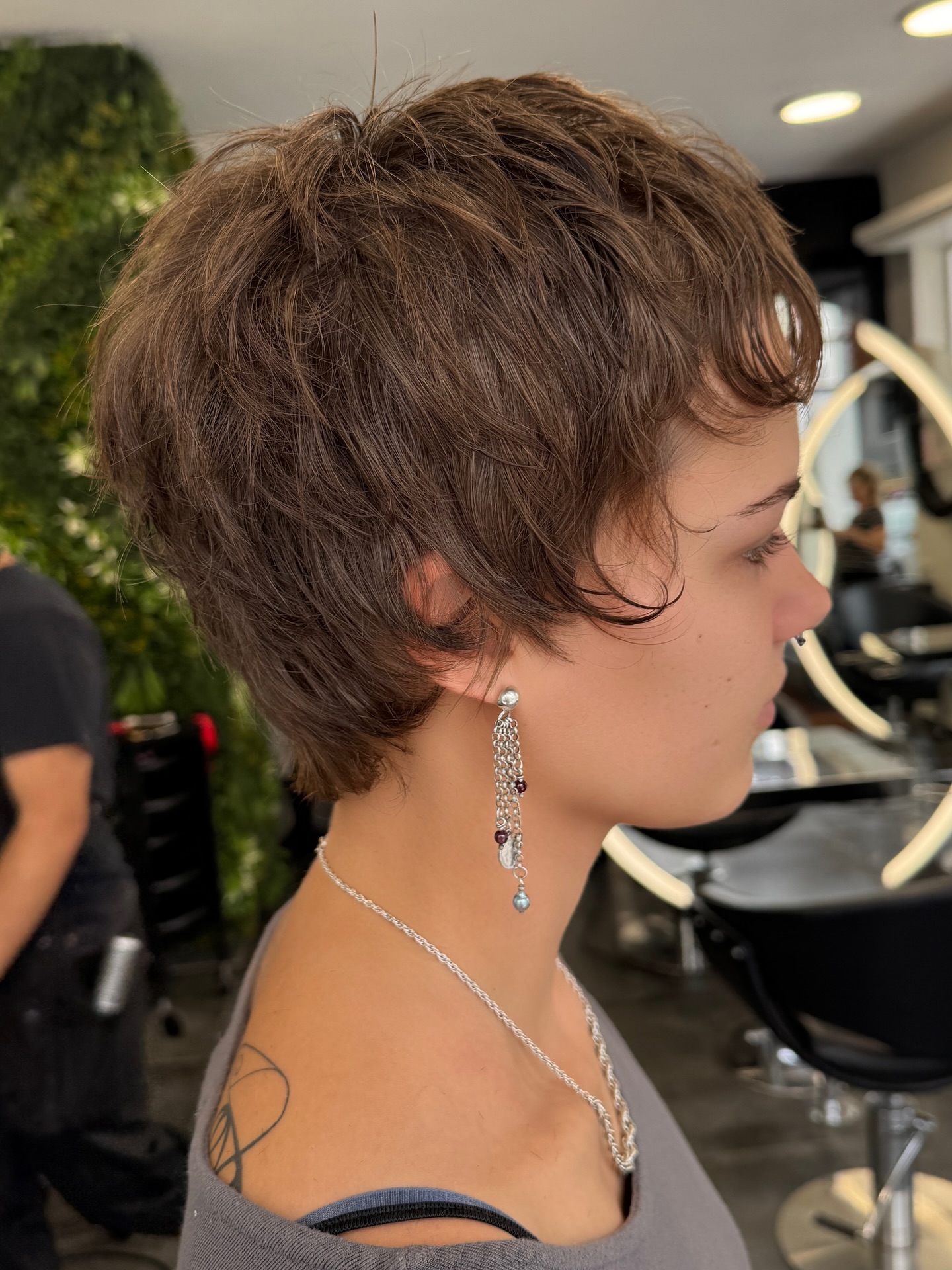 Chic Textured Brown Pixie with Playful Layers