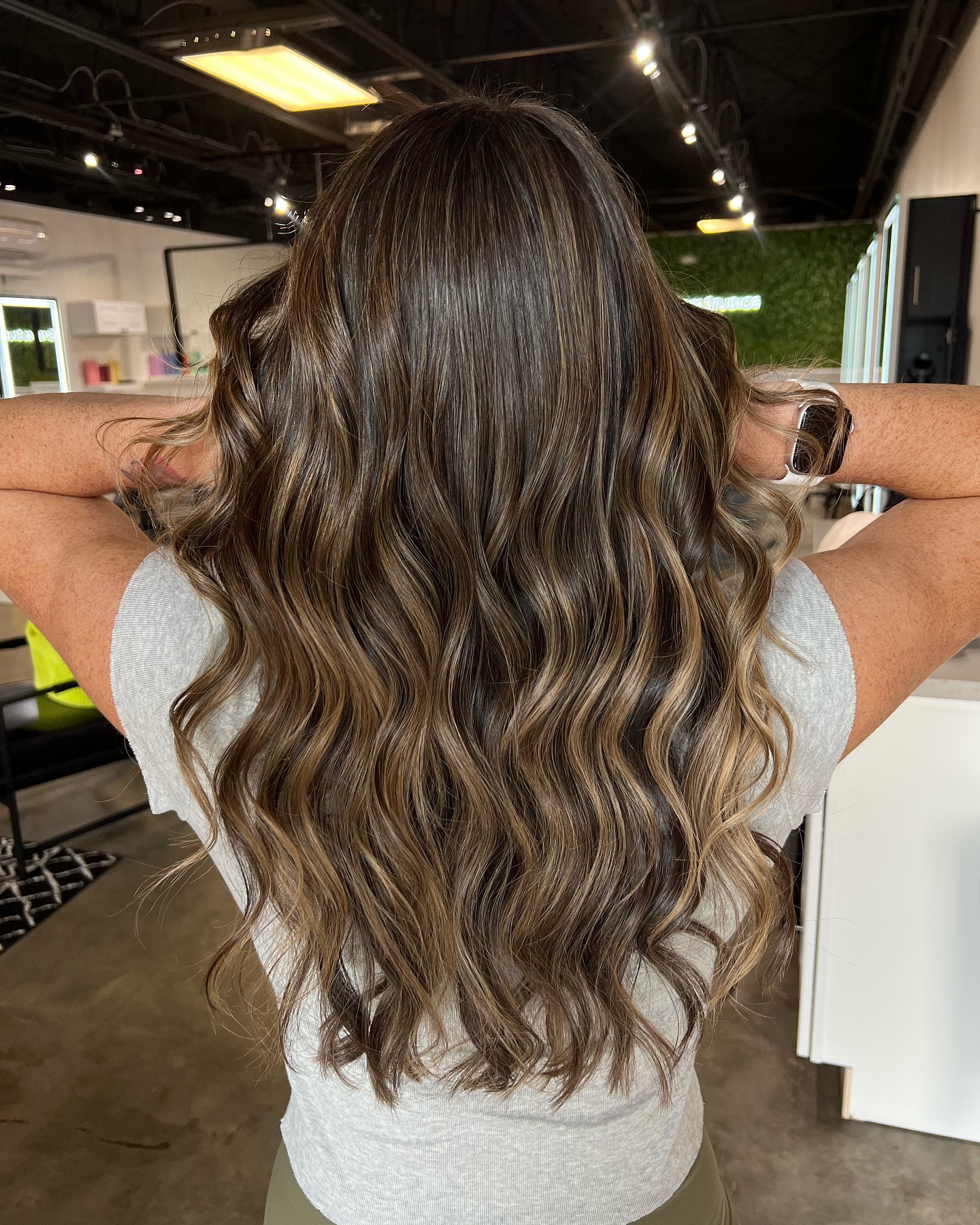 Warm Brunette Curls with Subtle Caramel Highlights