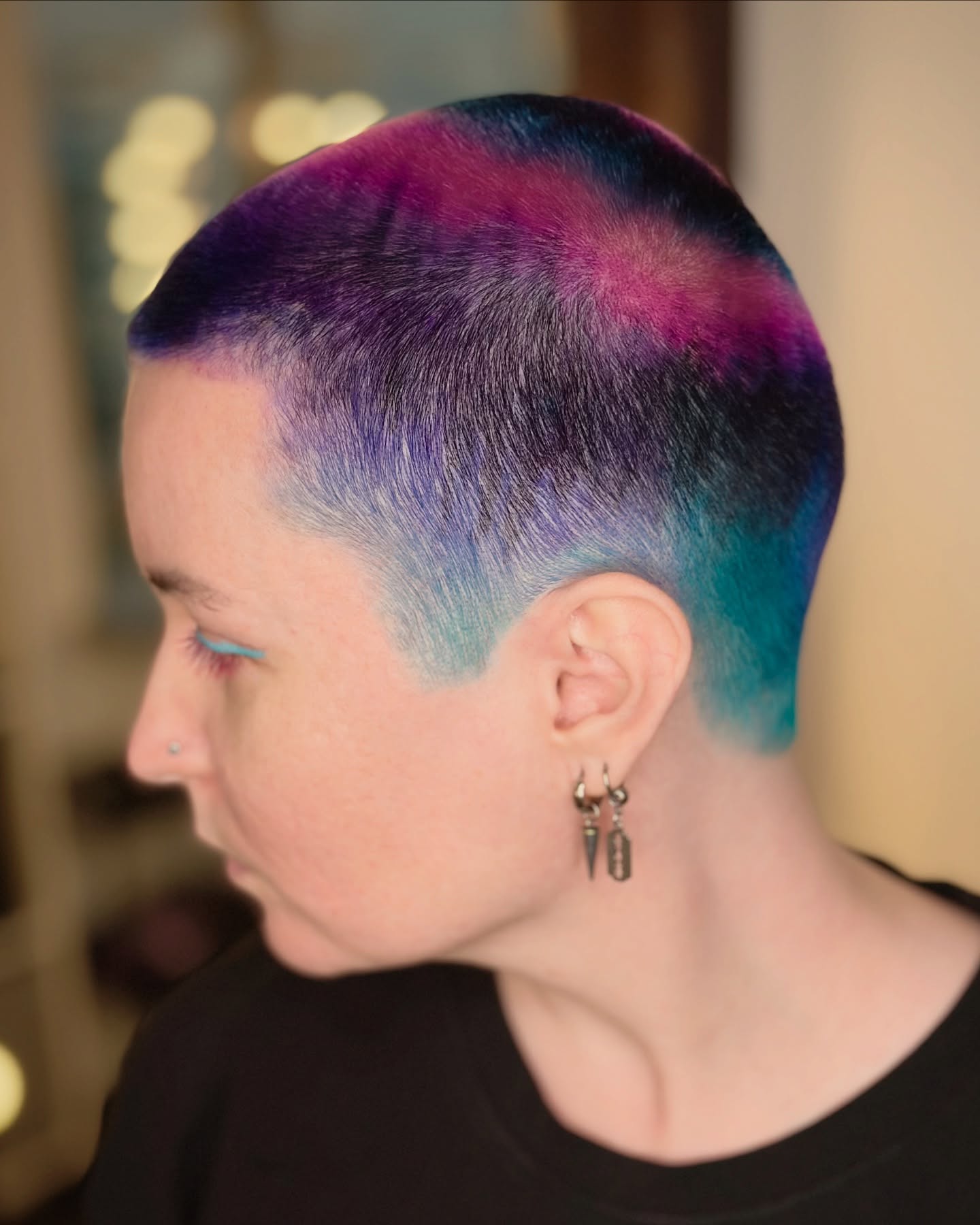 Bold Artistic Buzz Cut with Vibrant Color Transitions