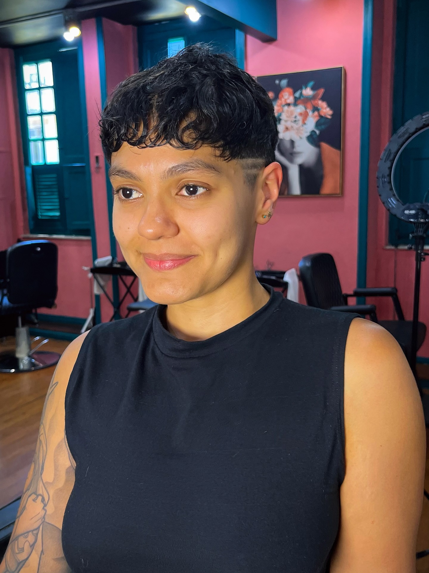 Chic Curly Tapered Pixie with Subtle Highlights