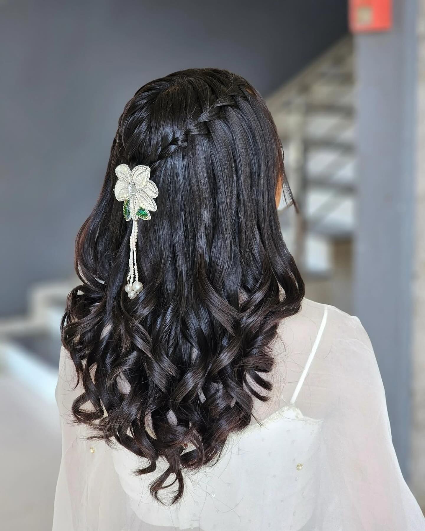 Elegant Ebony Curls with Intricate Braided Detail