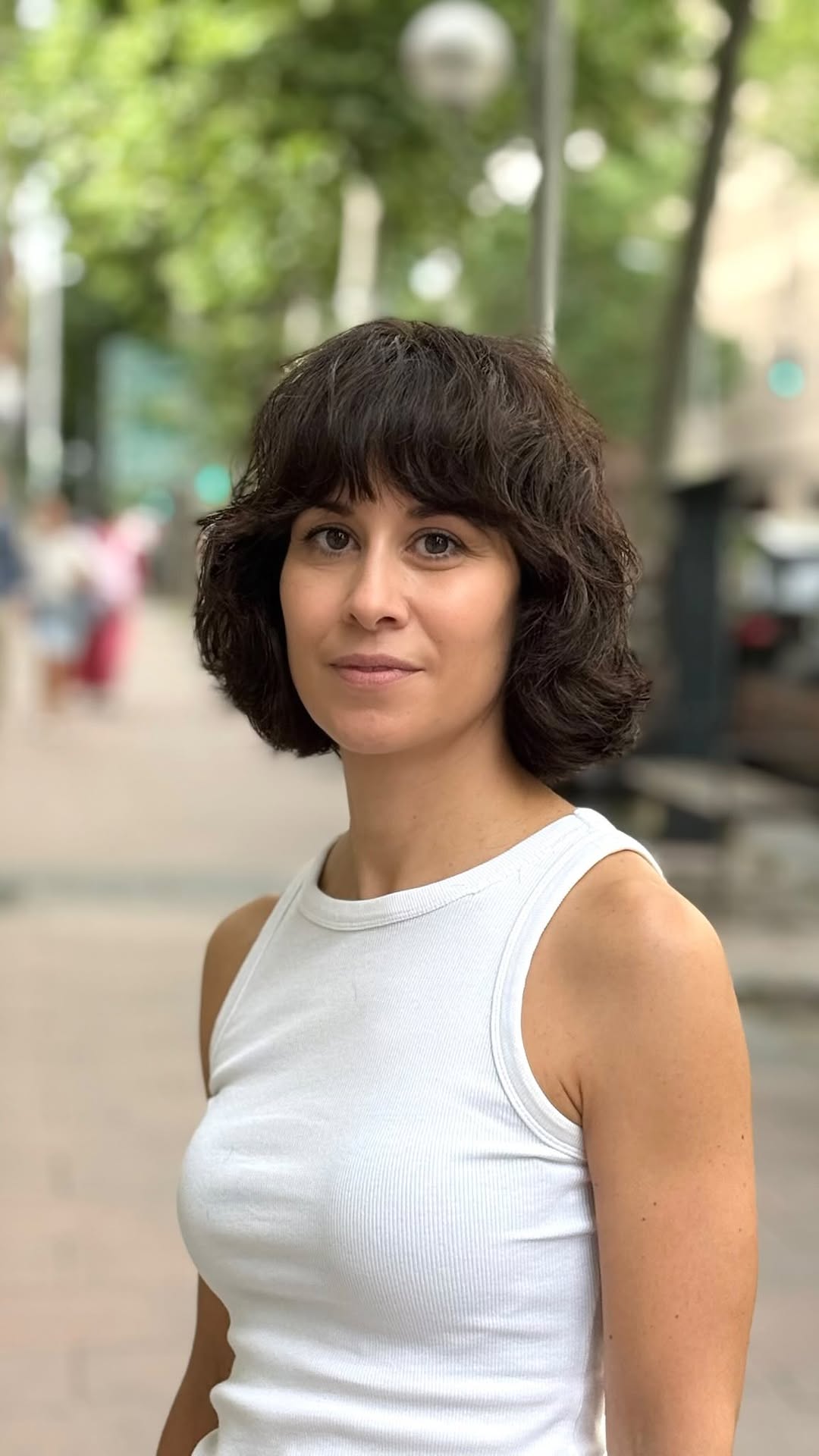 Elegant Espresso Curled Bob with Arched Bangs