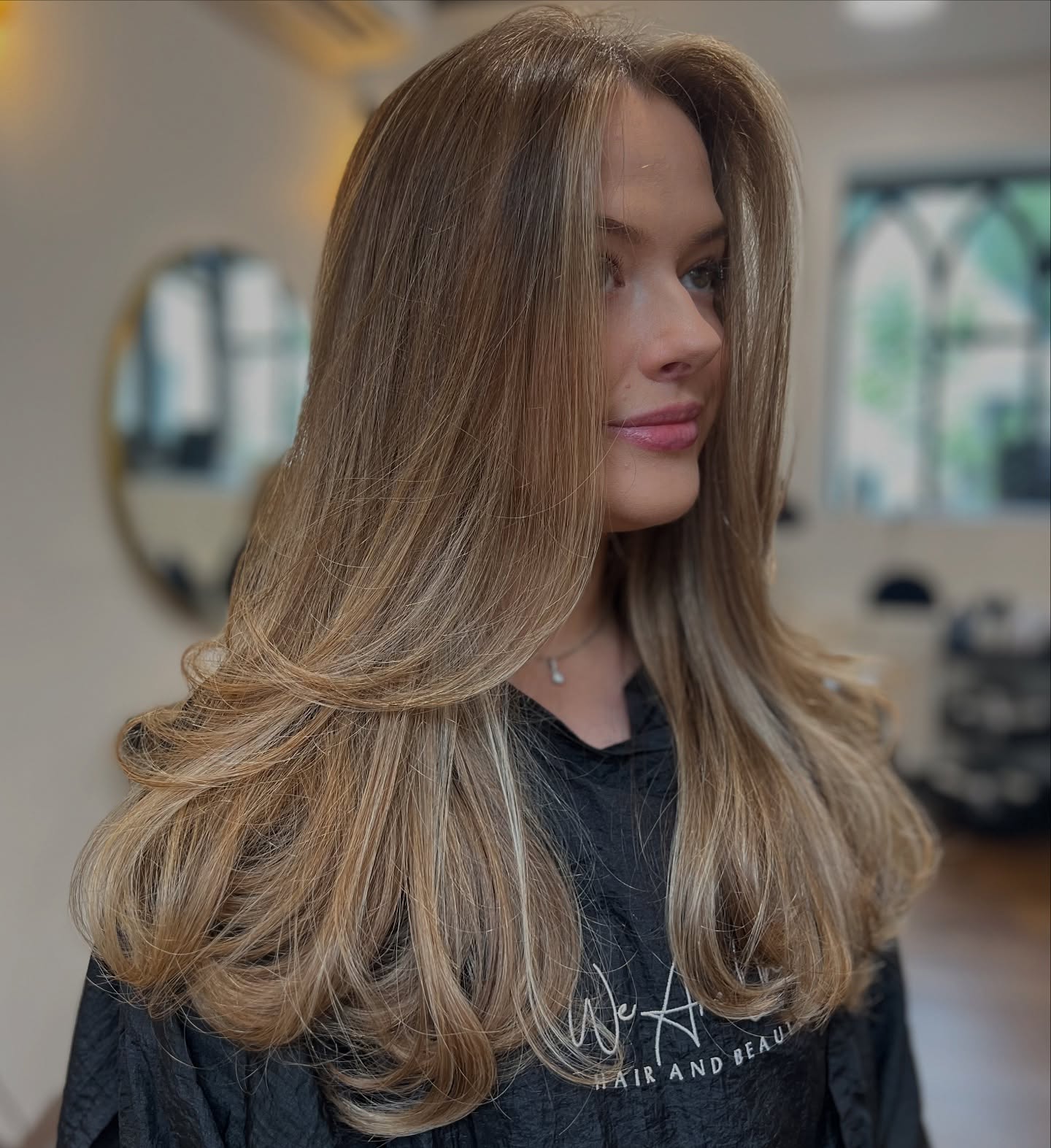 Elegant Long Voluminous Layers with Subtle Highlights