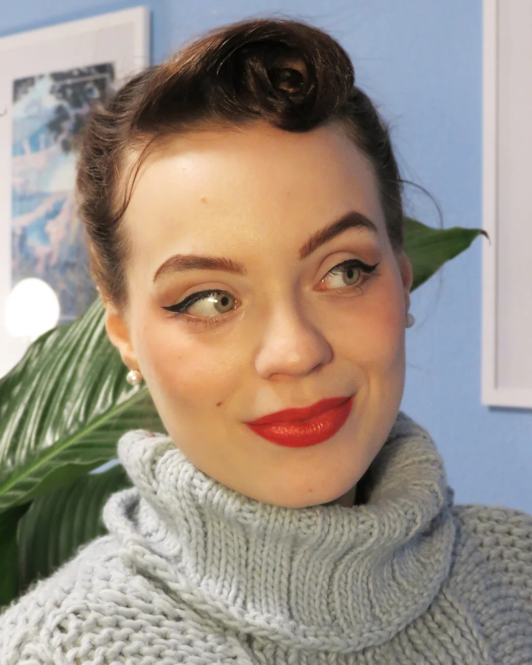Elegant Swept-Up Victory Roll with Soft Waves