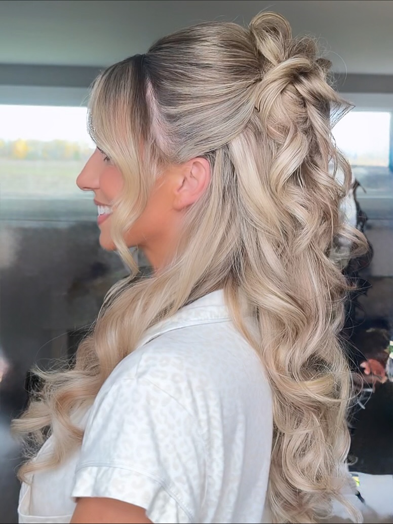Exquisite Blonde Waves with Poised Half-Up Knot