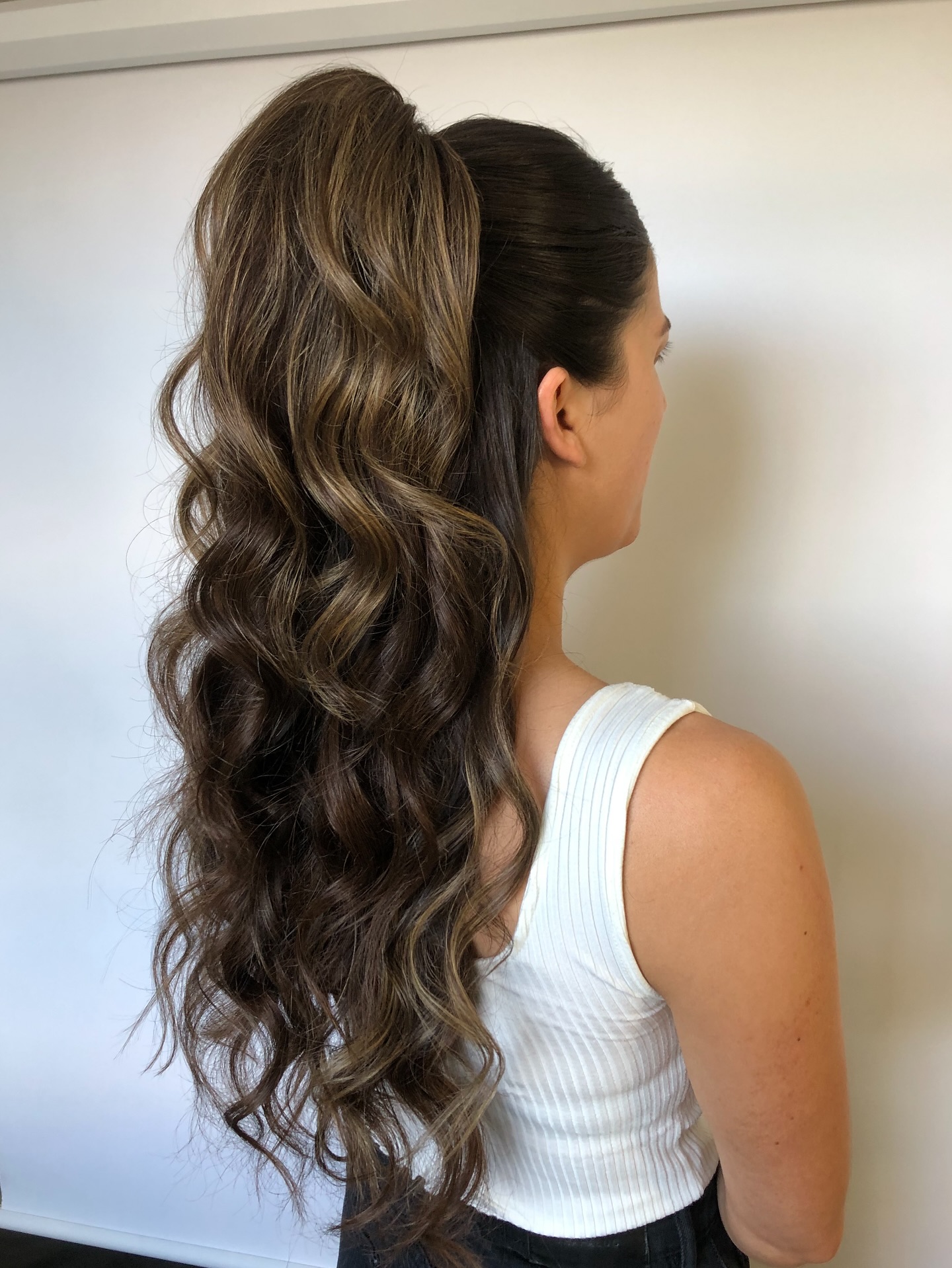 Flowing Chestnut Waves with Sleek Half-Up Style