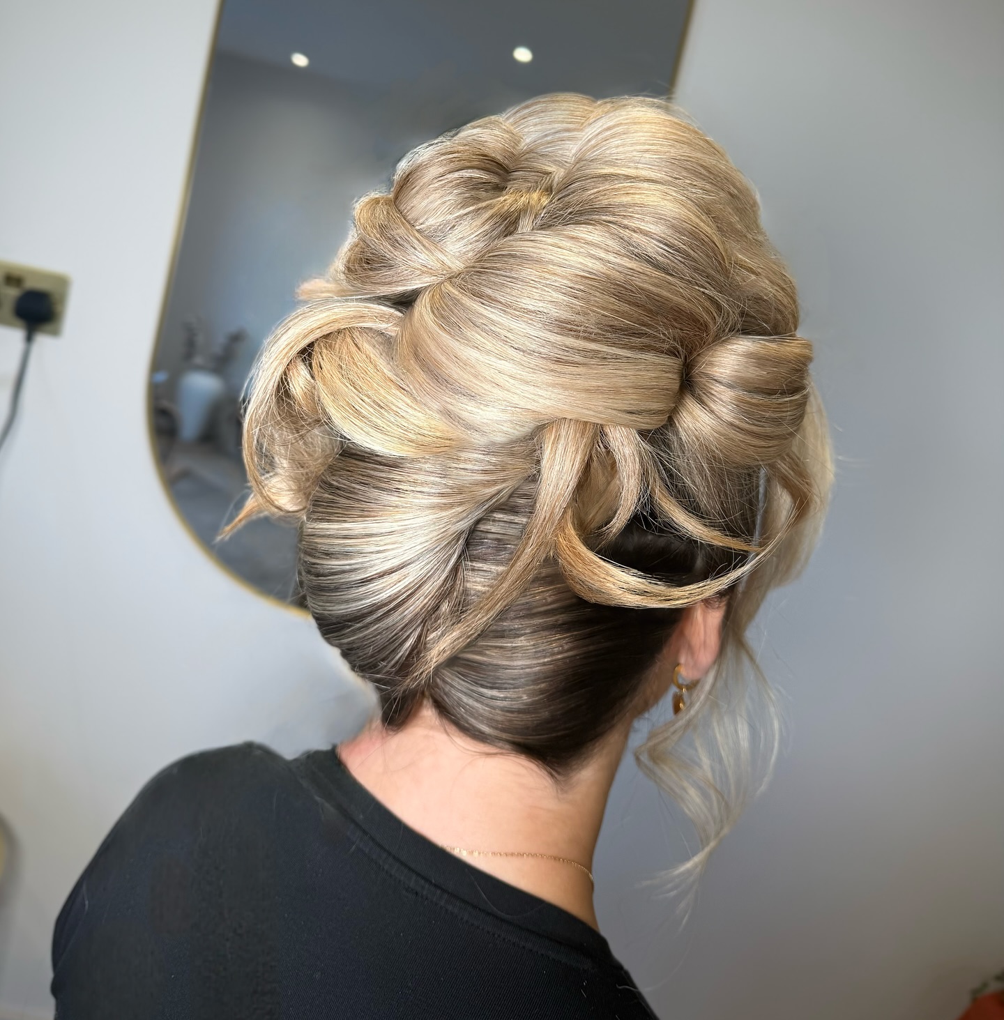 Intricate Victorian Swirl Bun with Blonde Highlights