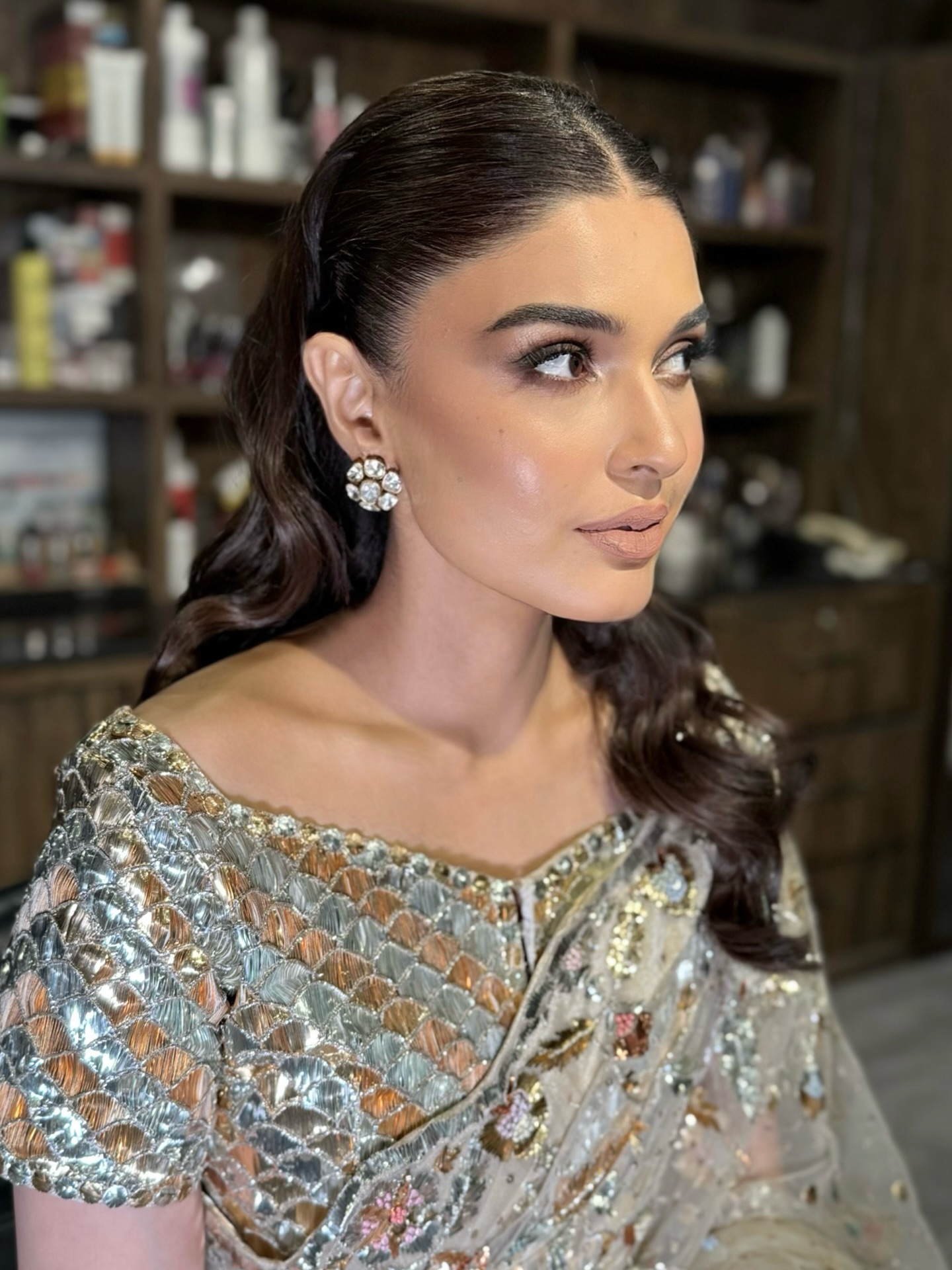 Luxurious Victorian Glossy Waves with a Sleek Part