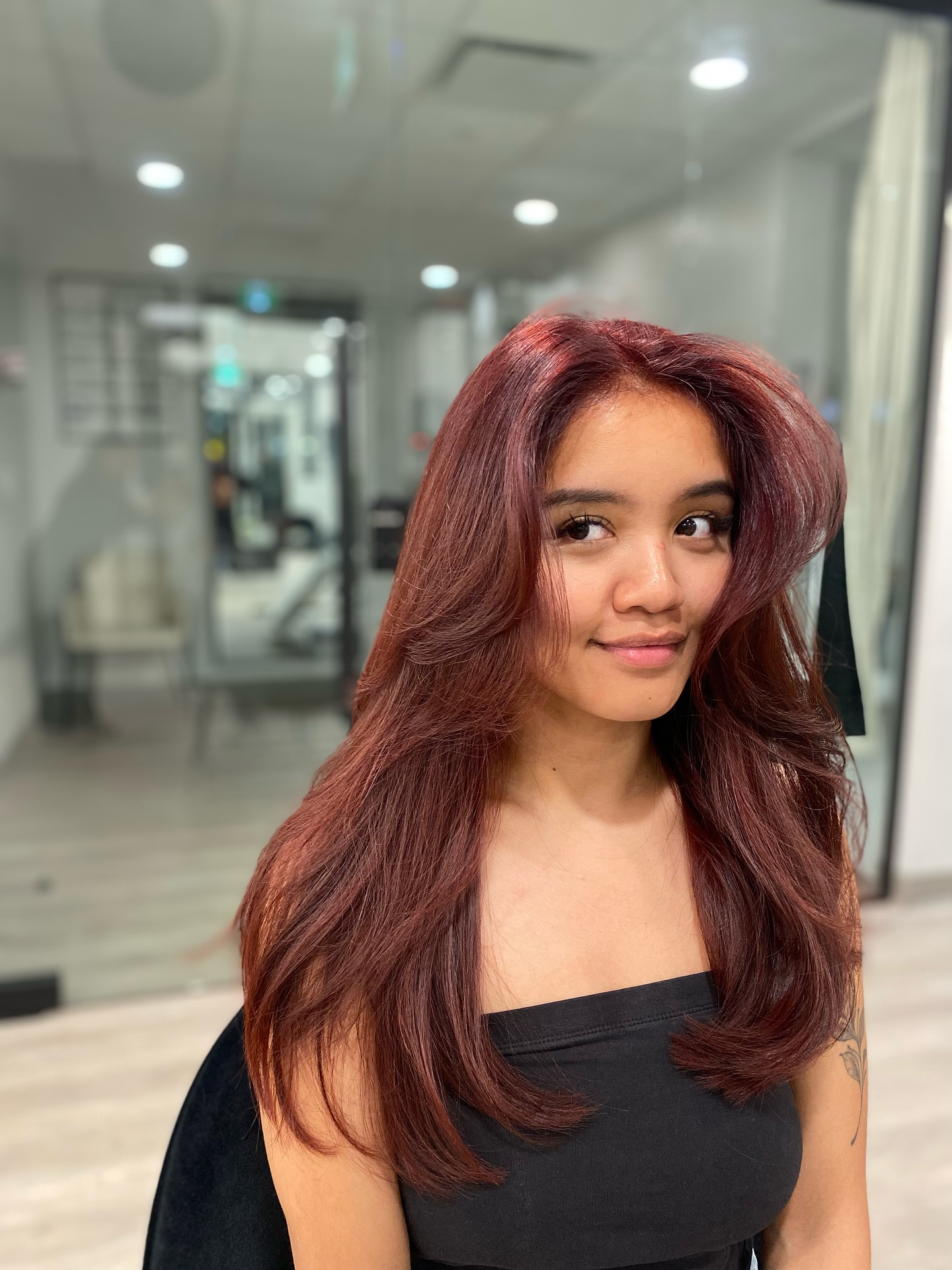 Rich Auburn Layers with Soft Curls