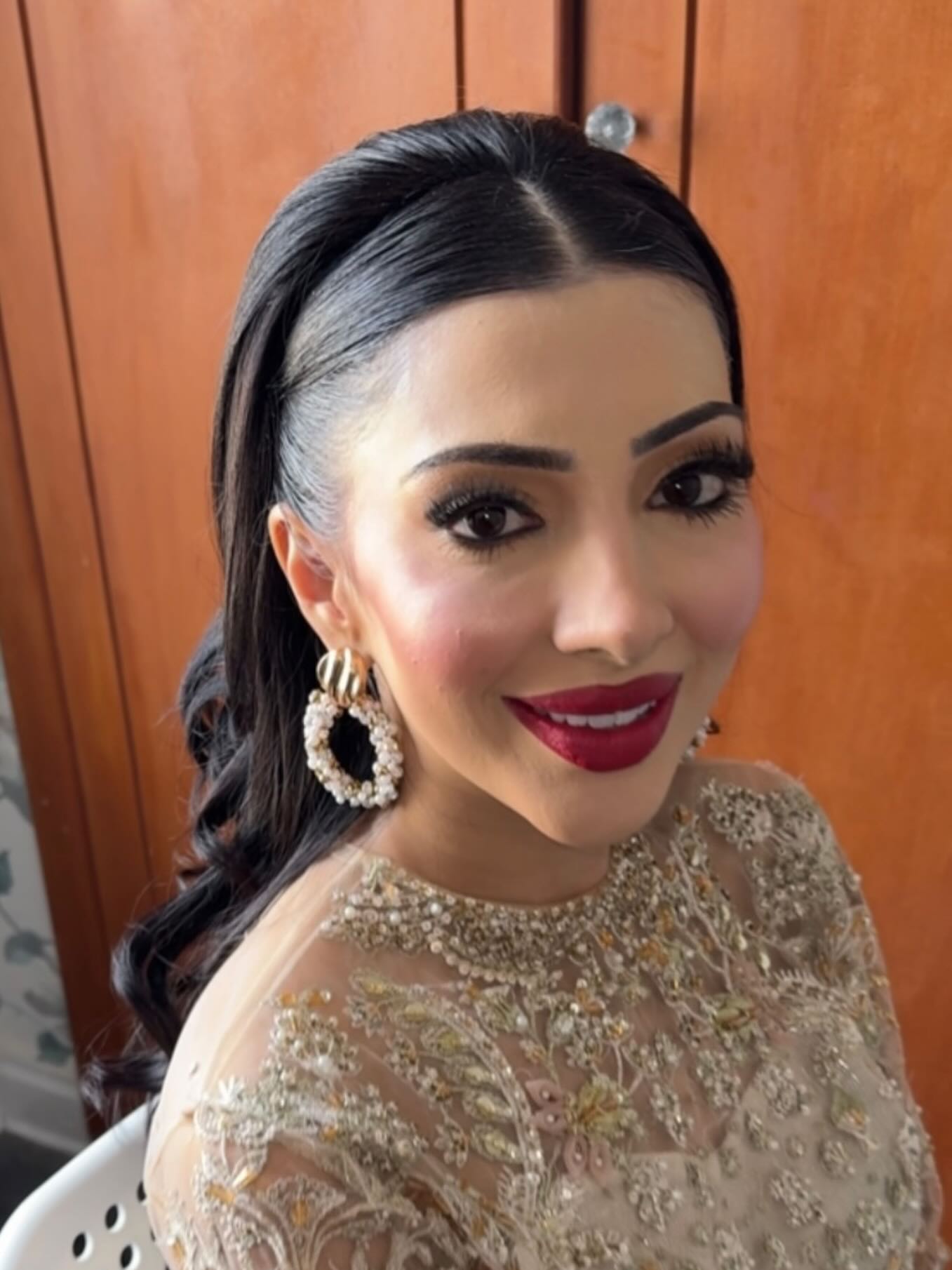 Sleek Victorian Side-Swept Ponytail with Ornate Curls