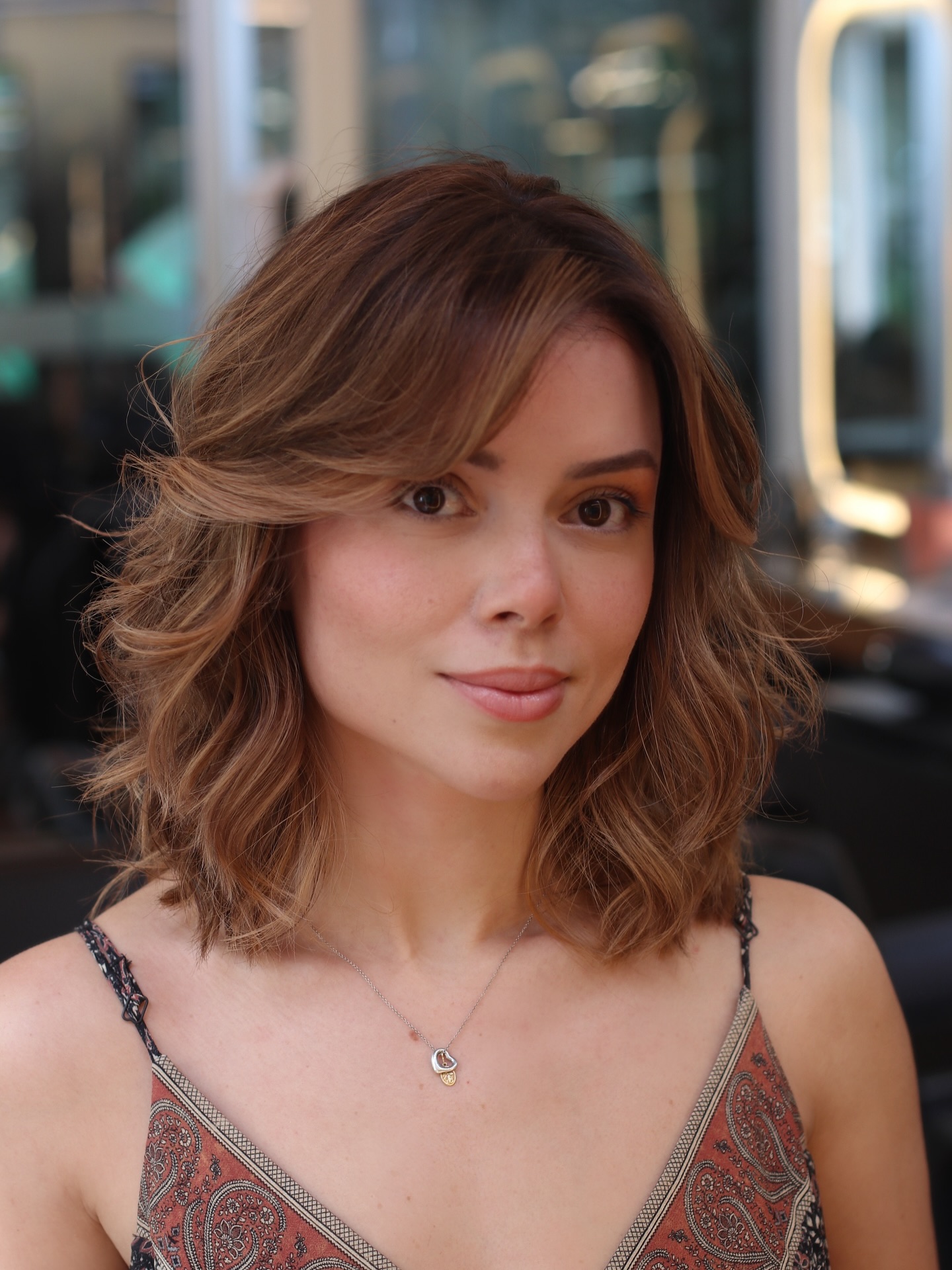 Soft Auburn Waves with Side-Swept Bangs