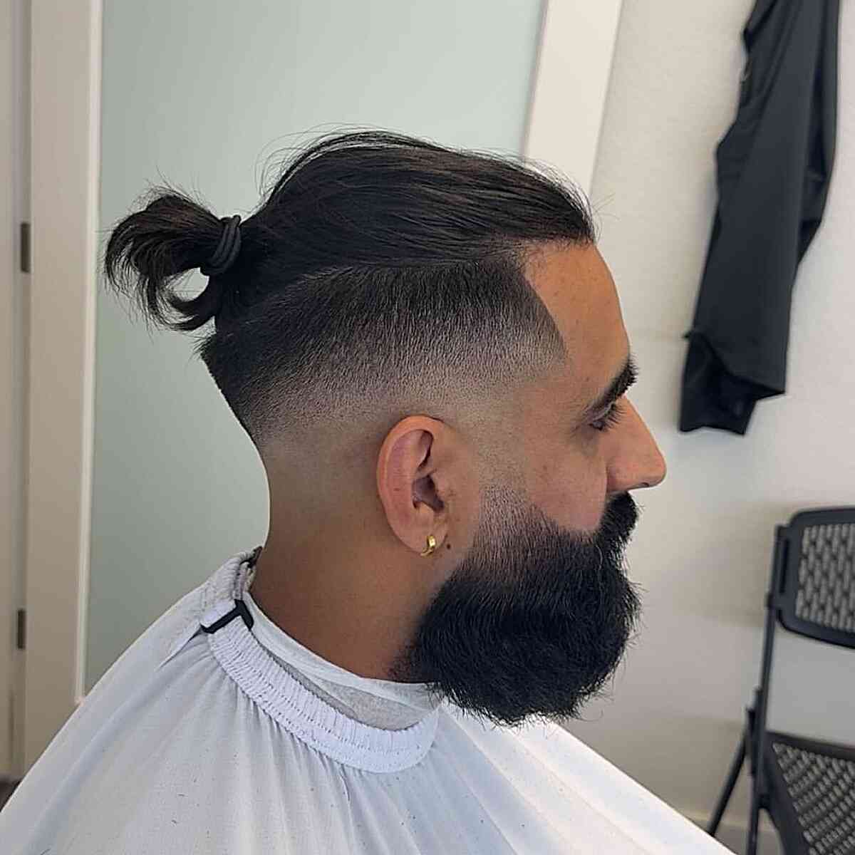 Stylish Man Bun with Undercut Fade