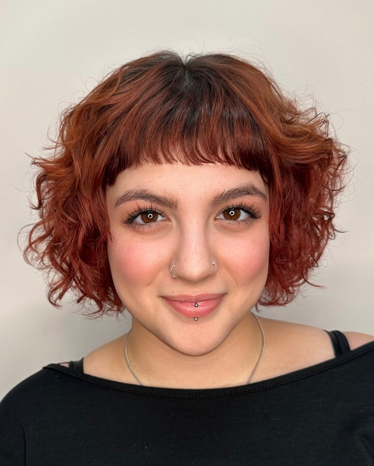 Vibrant Copper Curly Bob with Rounded Fringe