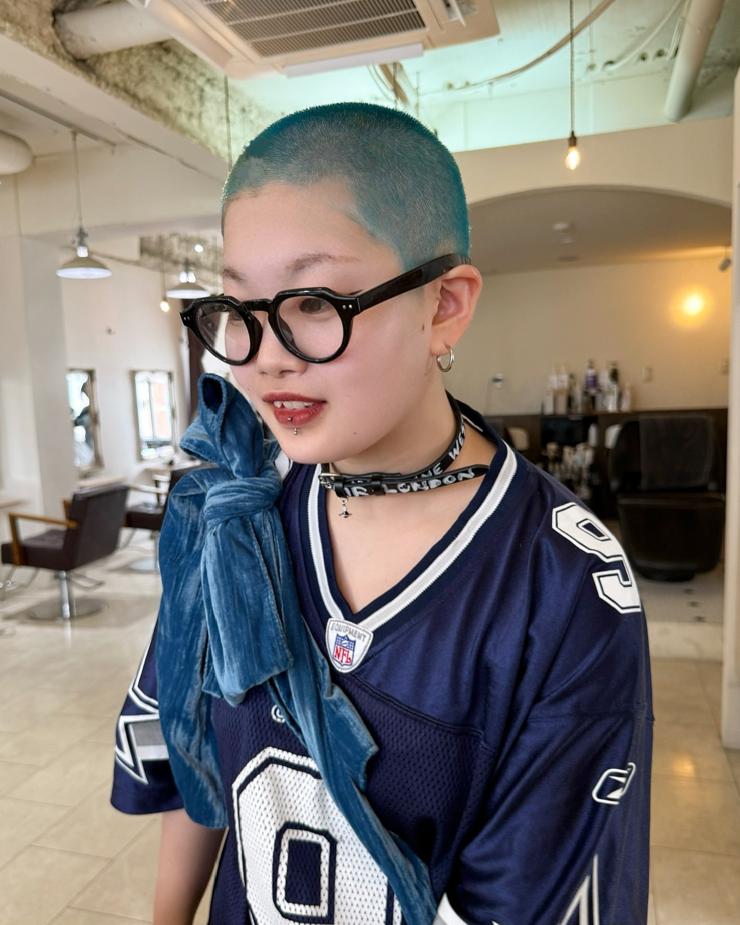 Vibrant Teal Buzz Cut with Soft Edges