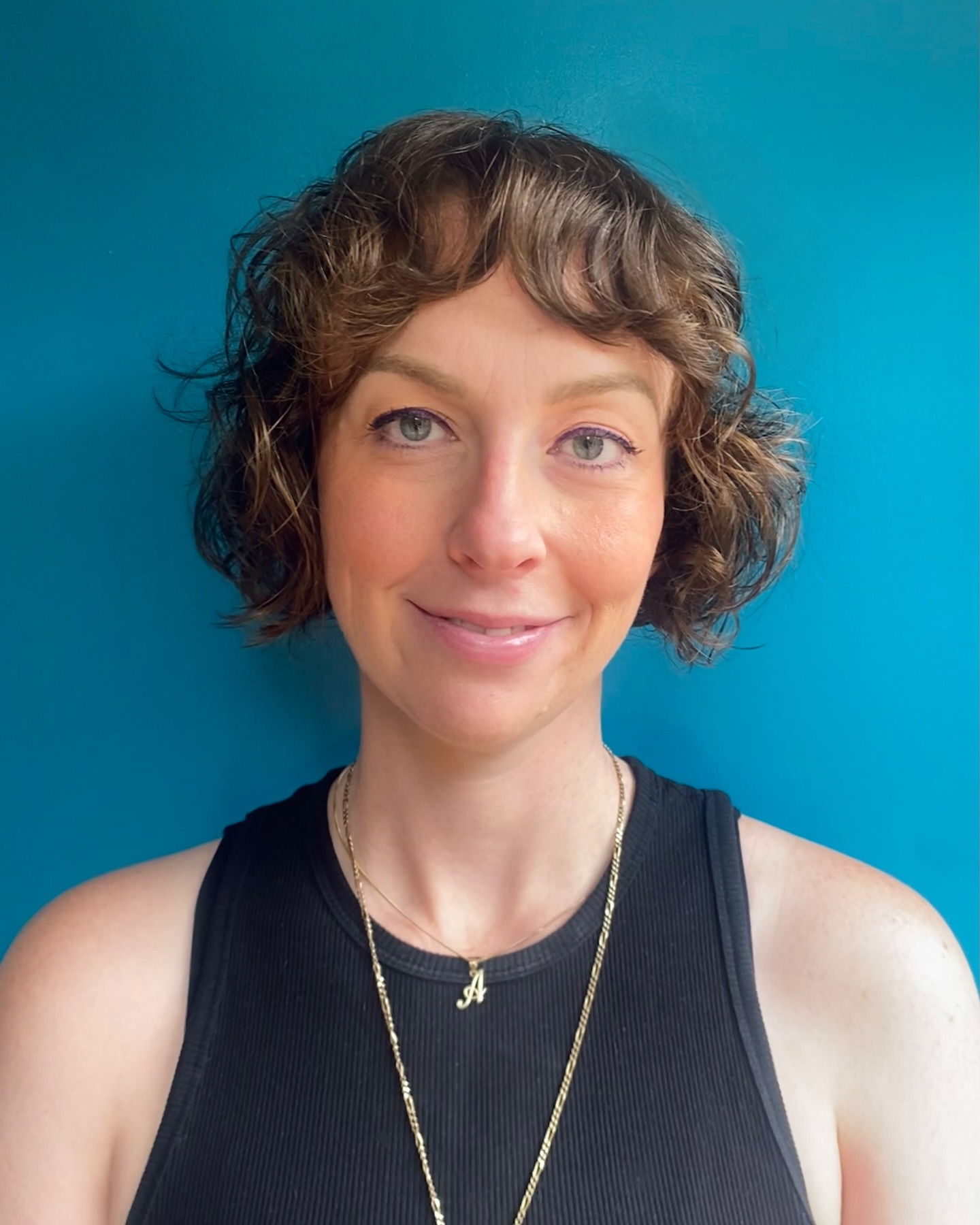 Chic Curly Bob with Playful Bangs