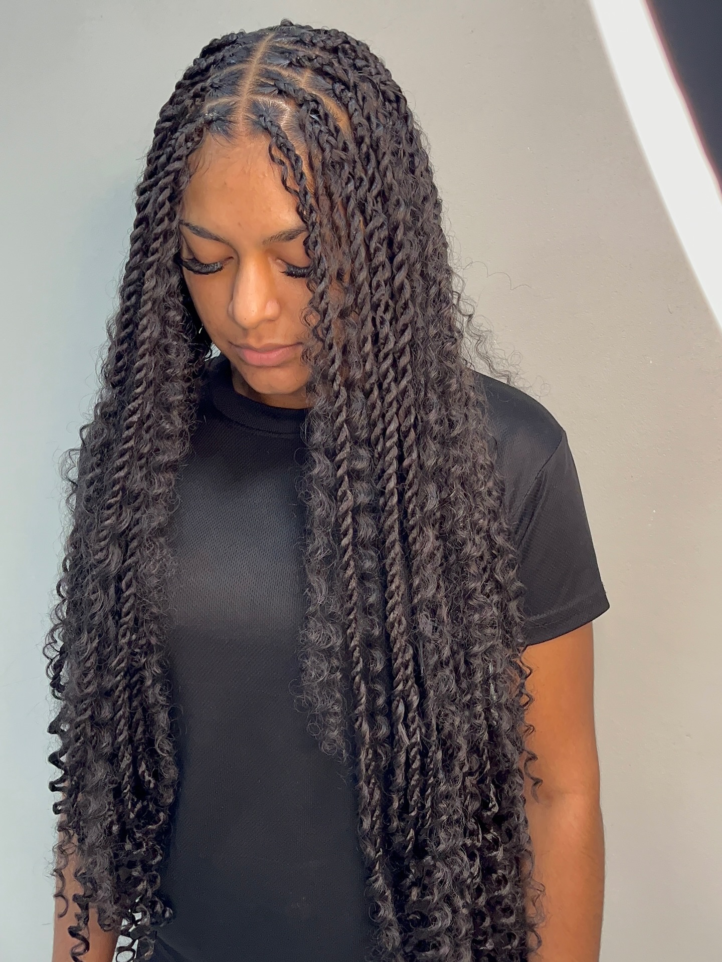 Elegant Long Twisted Curls with Defined Parting