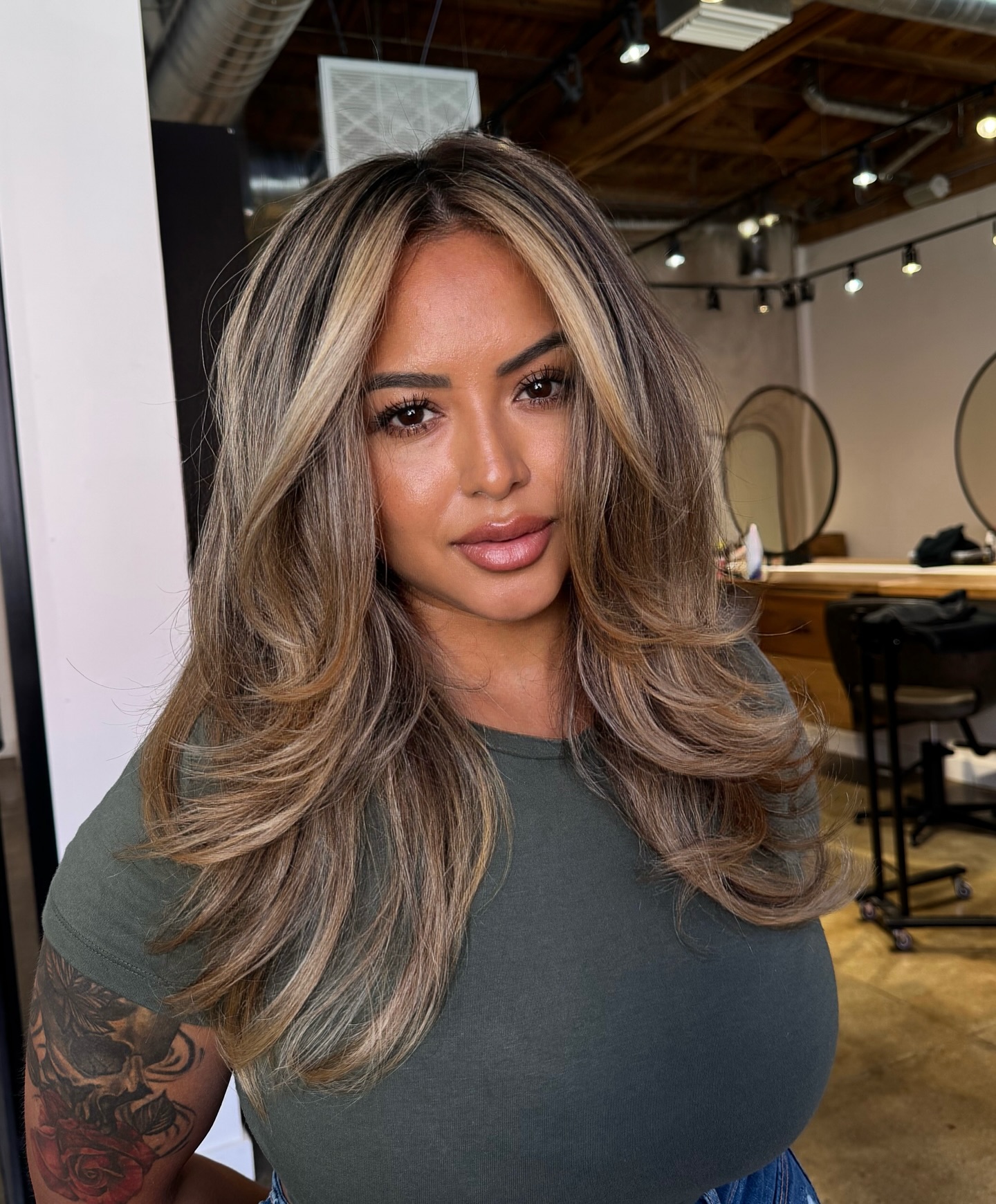 Glamorous Honey Blonde Layered Cut with Face-Enhancing Highlights