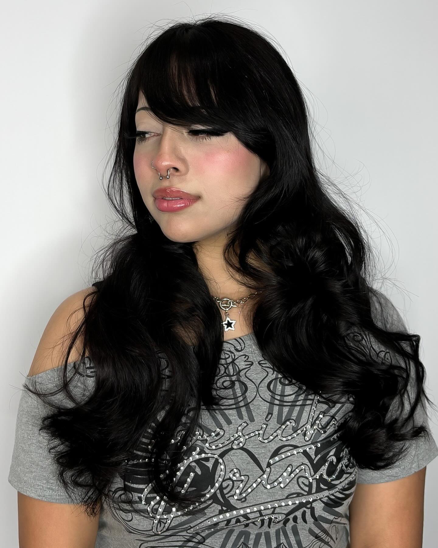Glossy Black Waves with Side-Swept Bangs