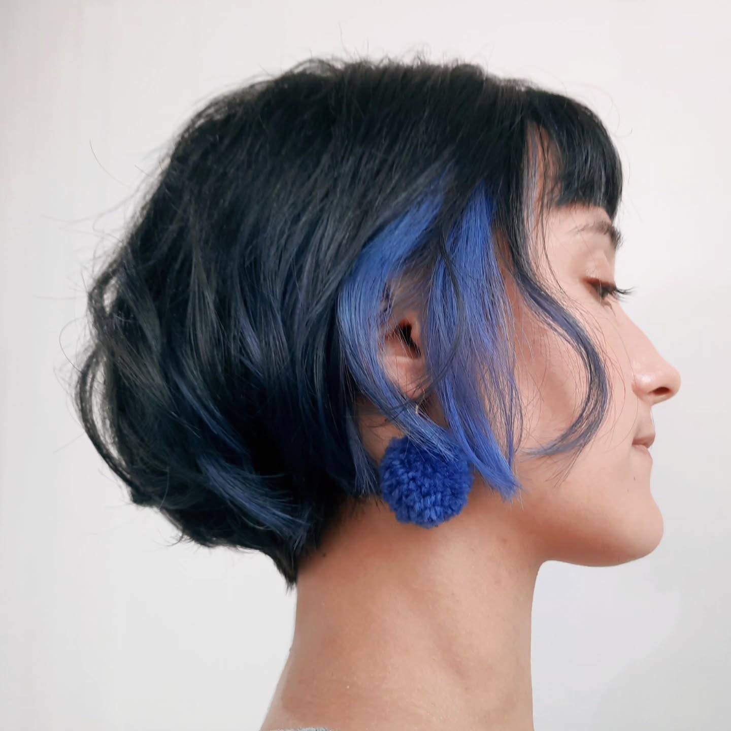 Modern Textured Bob with Vibrant Blue Highlights