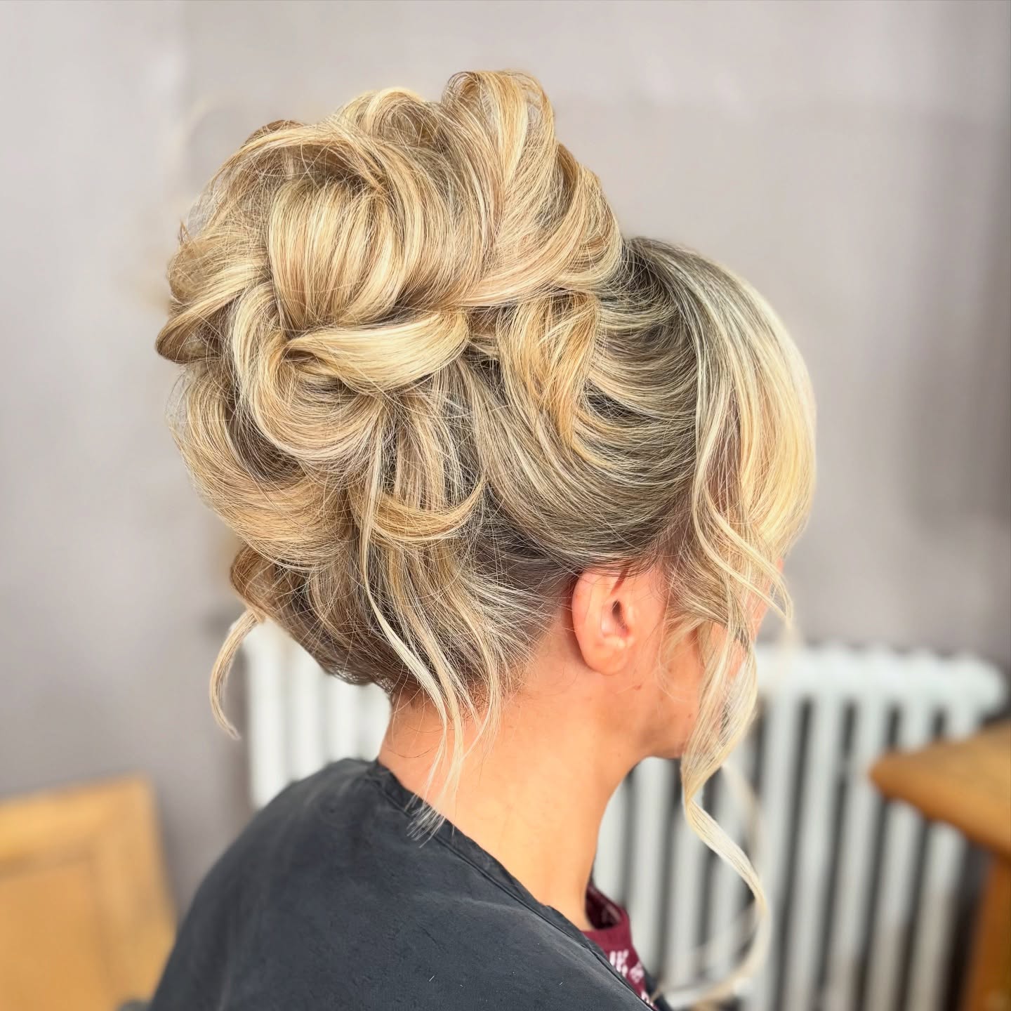 Sculpted Blonde Updo with Textured Twists