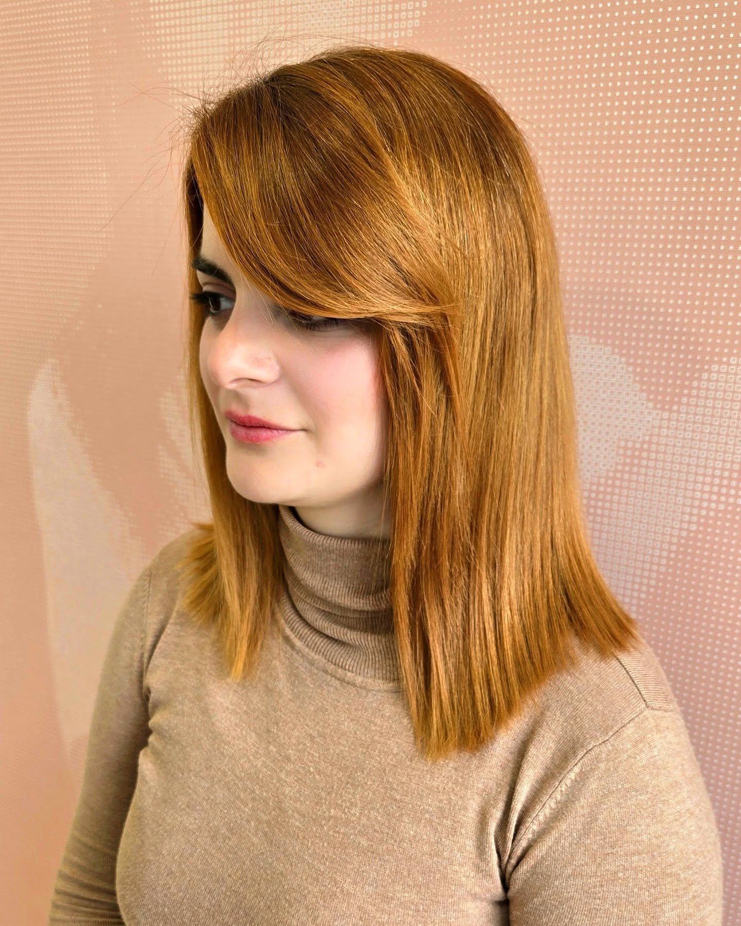 Sleek Copper Bob with Side-Swept Layers