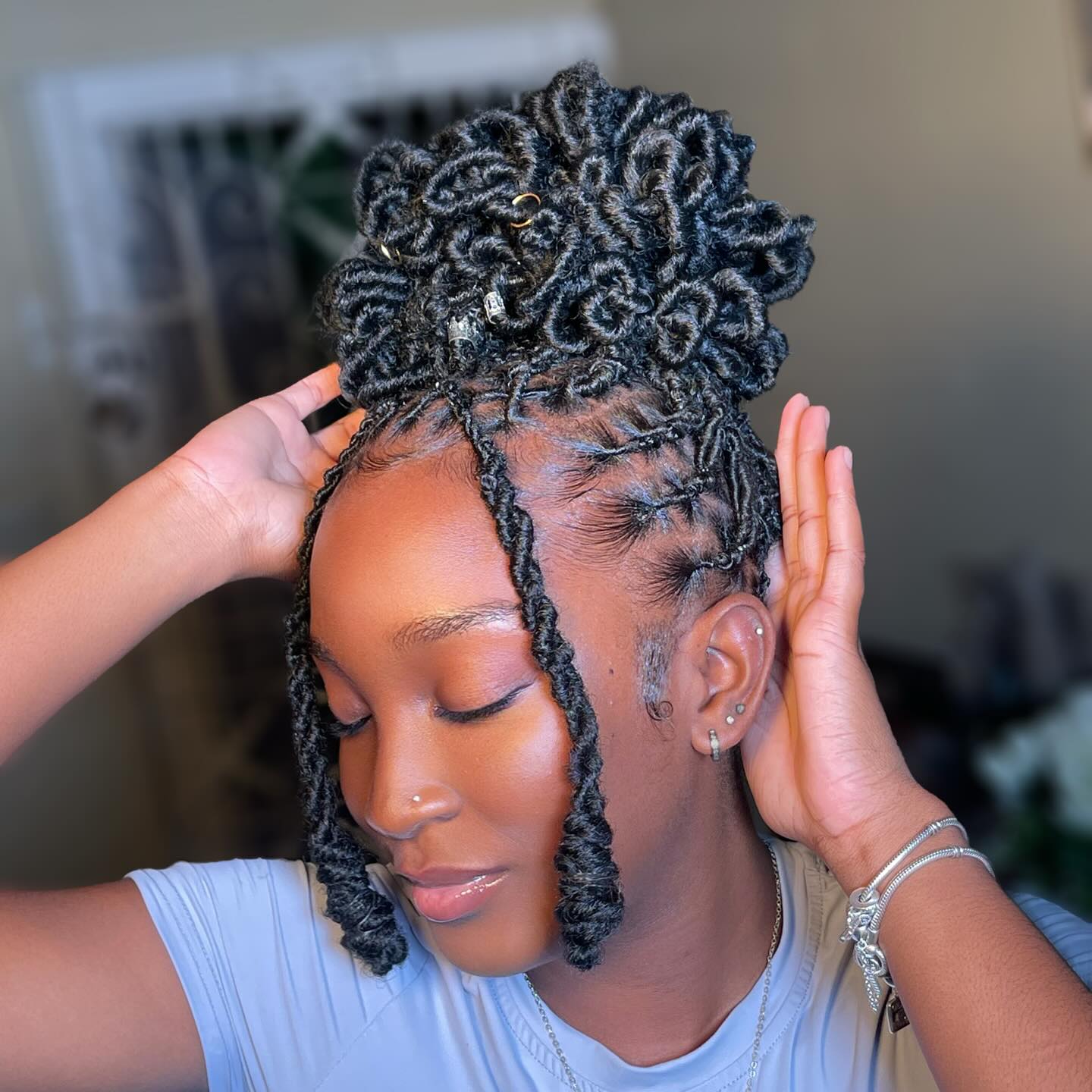 Stylish Twisted Updo with Face-Framing Curls