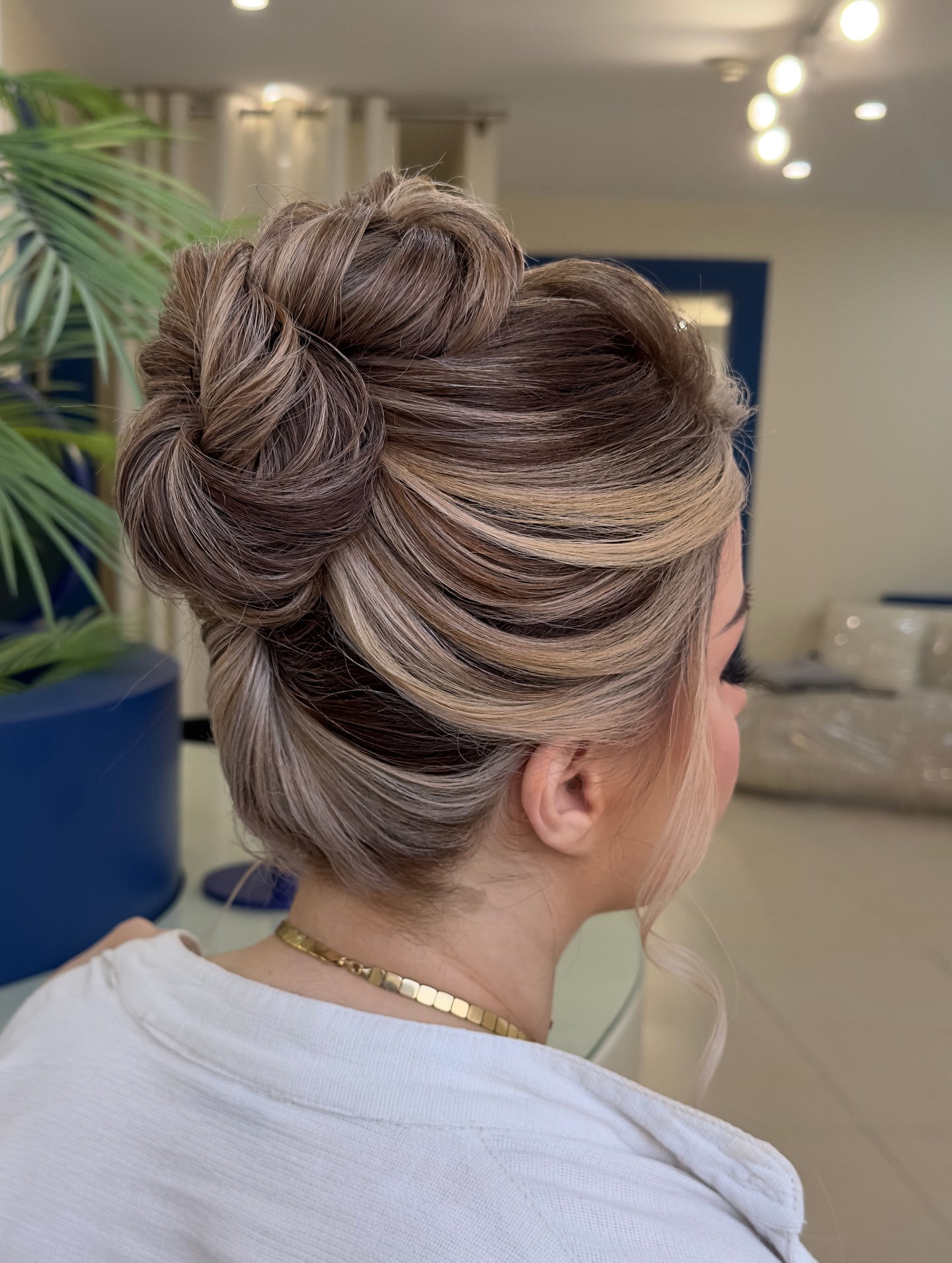 Artistic Swirls Bun with Contrasting Highlights
