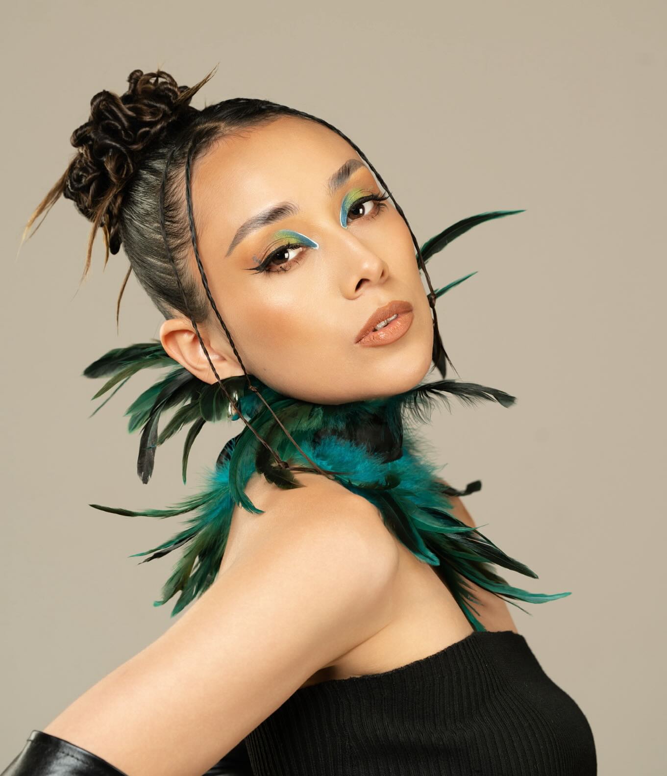 Avant-Garde Feathered Updo with Earthy Accents