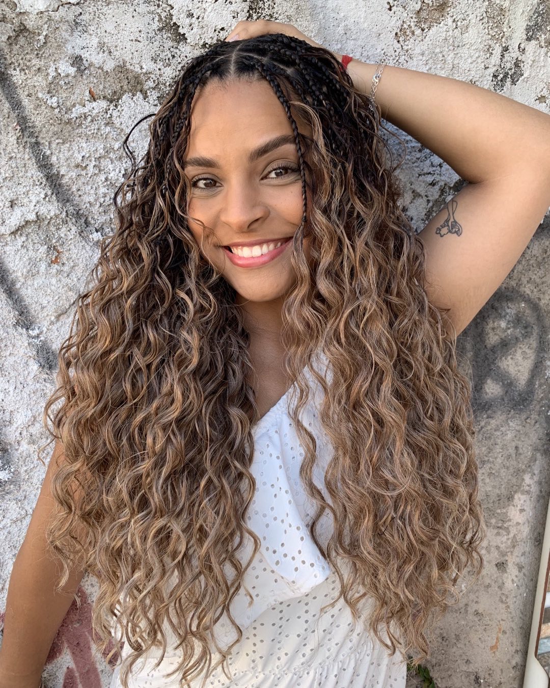 Cascading Multi-Textured Curls with Braided Accents