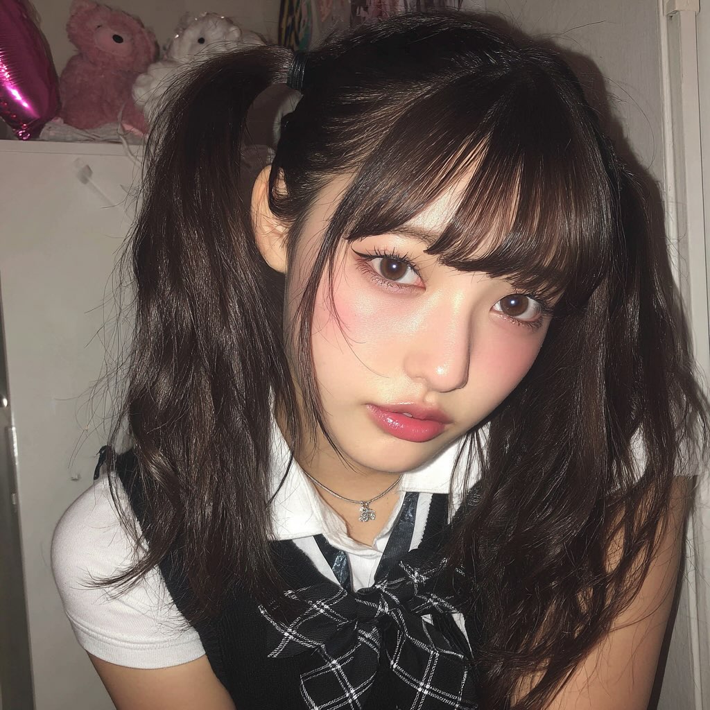 Chic Textured Pigtails with Face-Framing Bangs