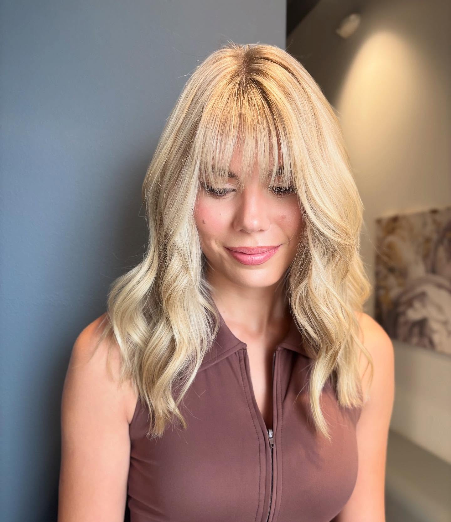 Effortless Blonde Waves with Chic Fringe