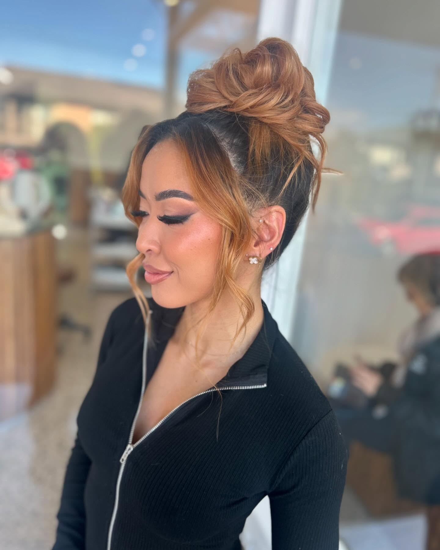 Elegant High Bun with Soft Caramel Highlights