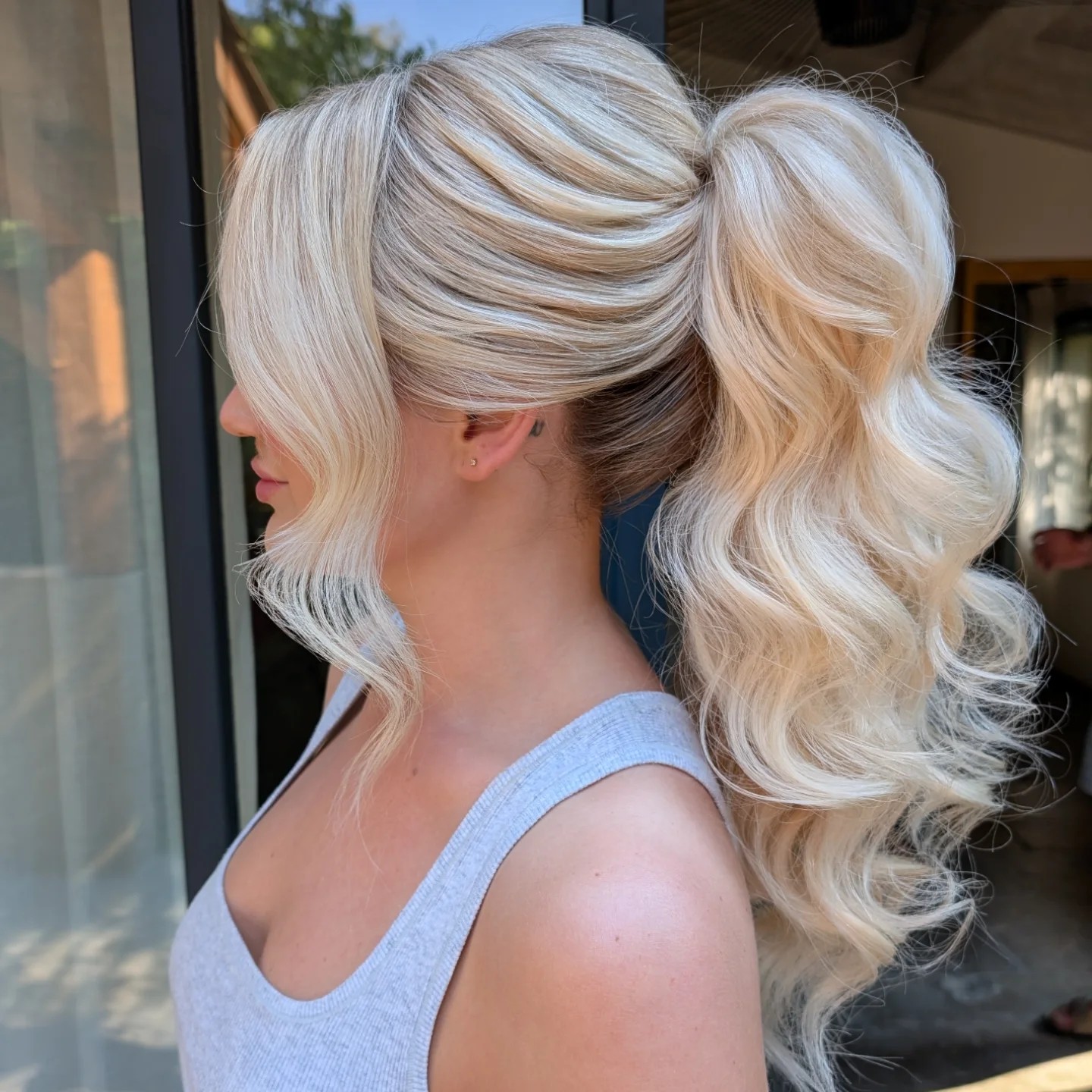 Enchanting Blonde Ponytail with Soft Curls