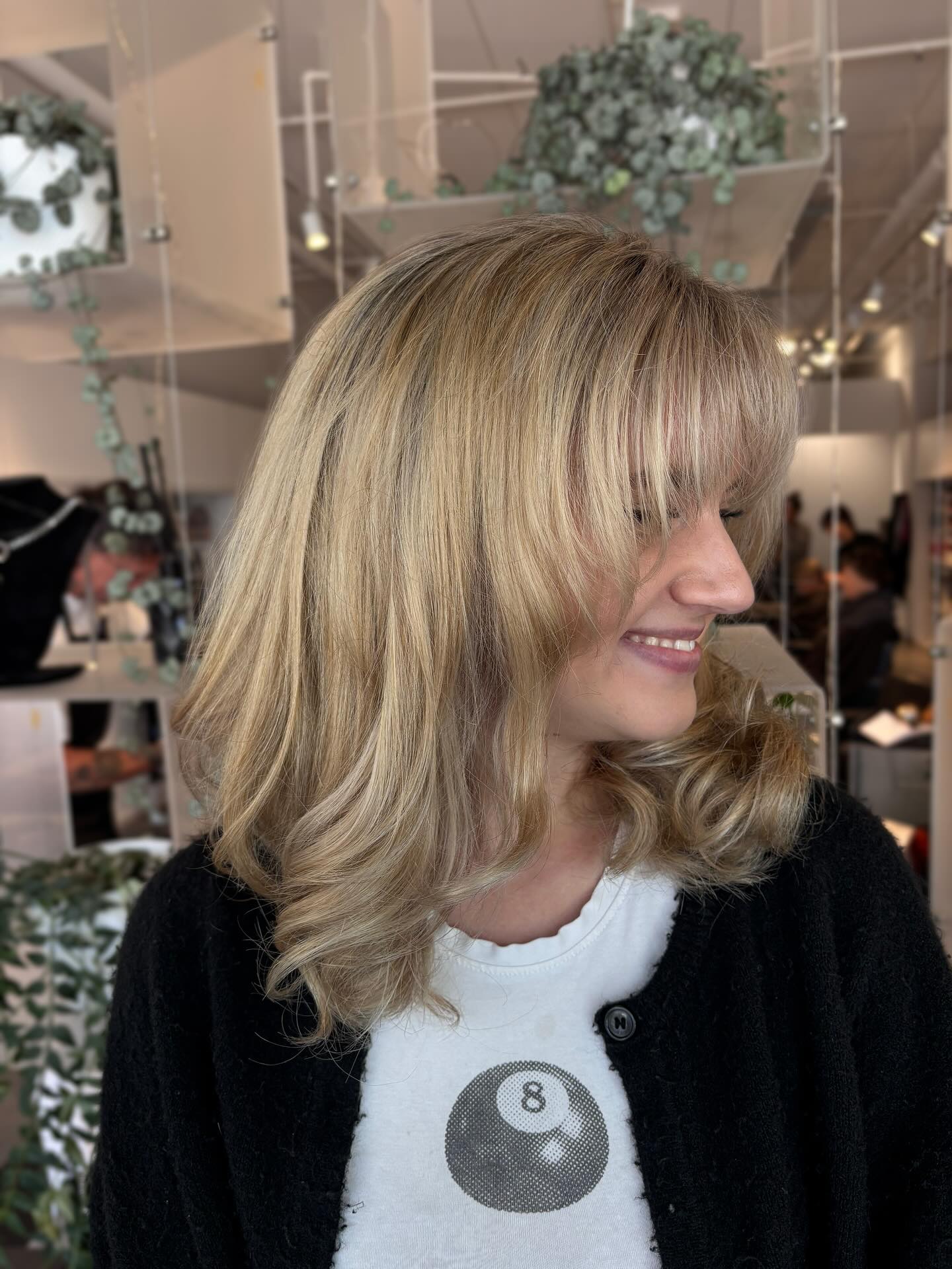 Light Blonde Waves with Softly Feathered Bangs