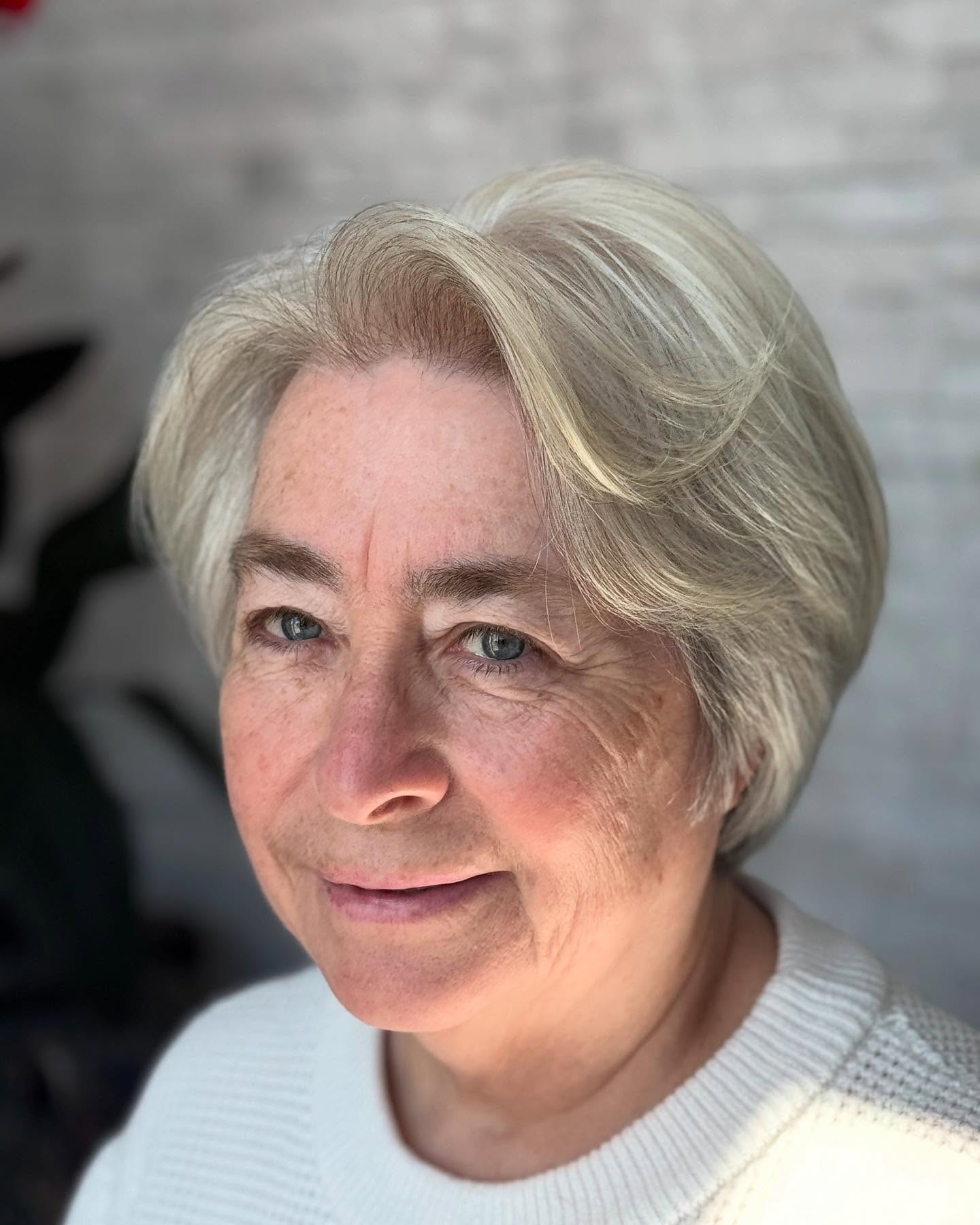Refined Silver Layered Bob for a Timeless Appeal