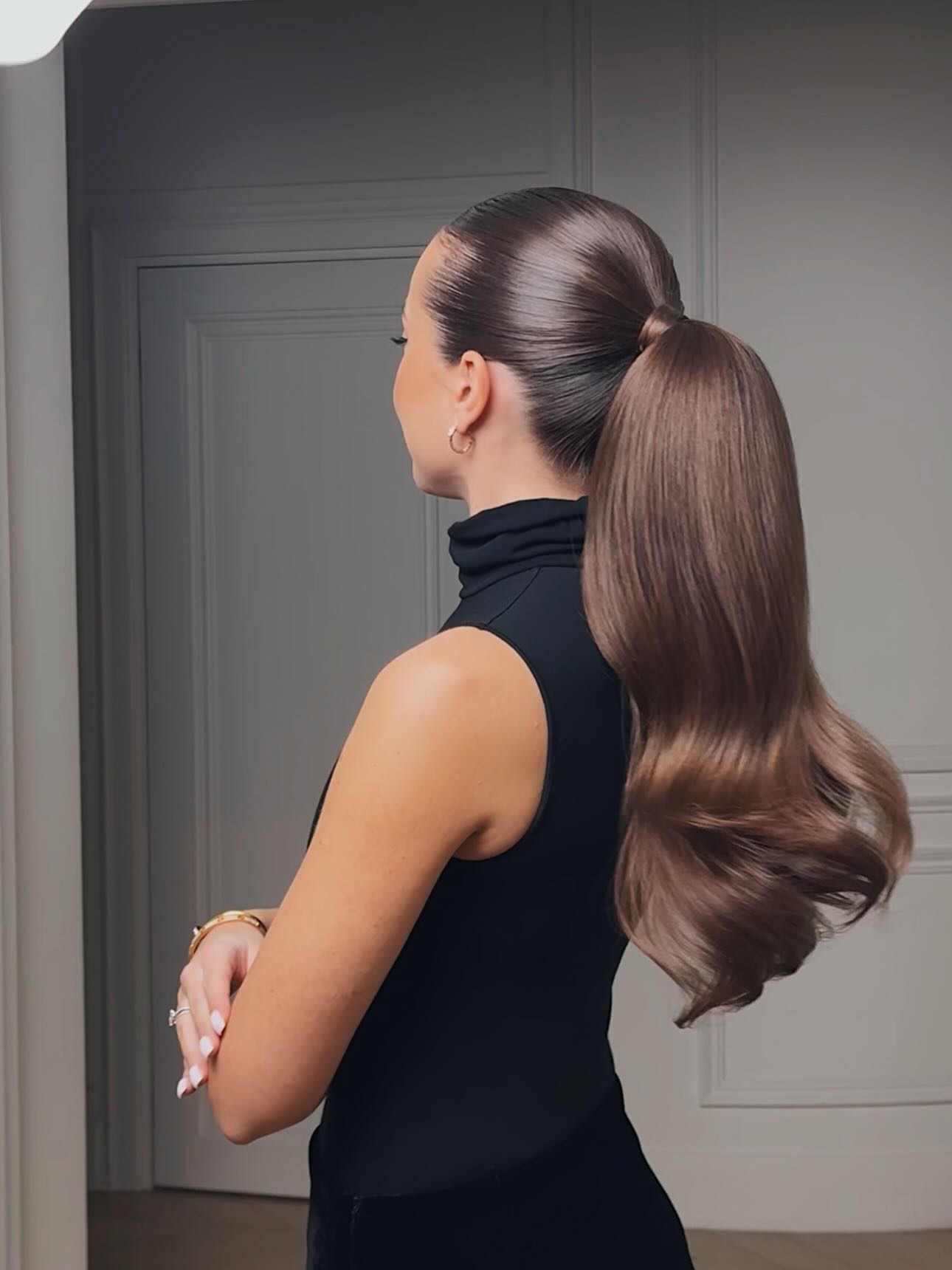Sleek Polished Ponytail with Voluminous Curls