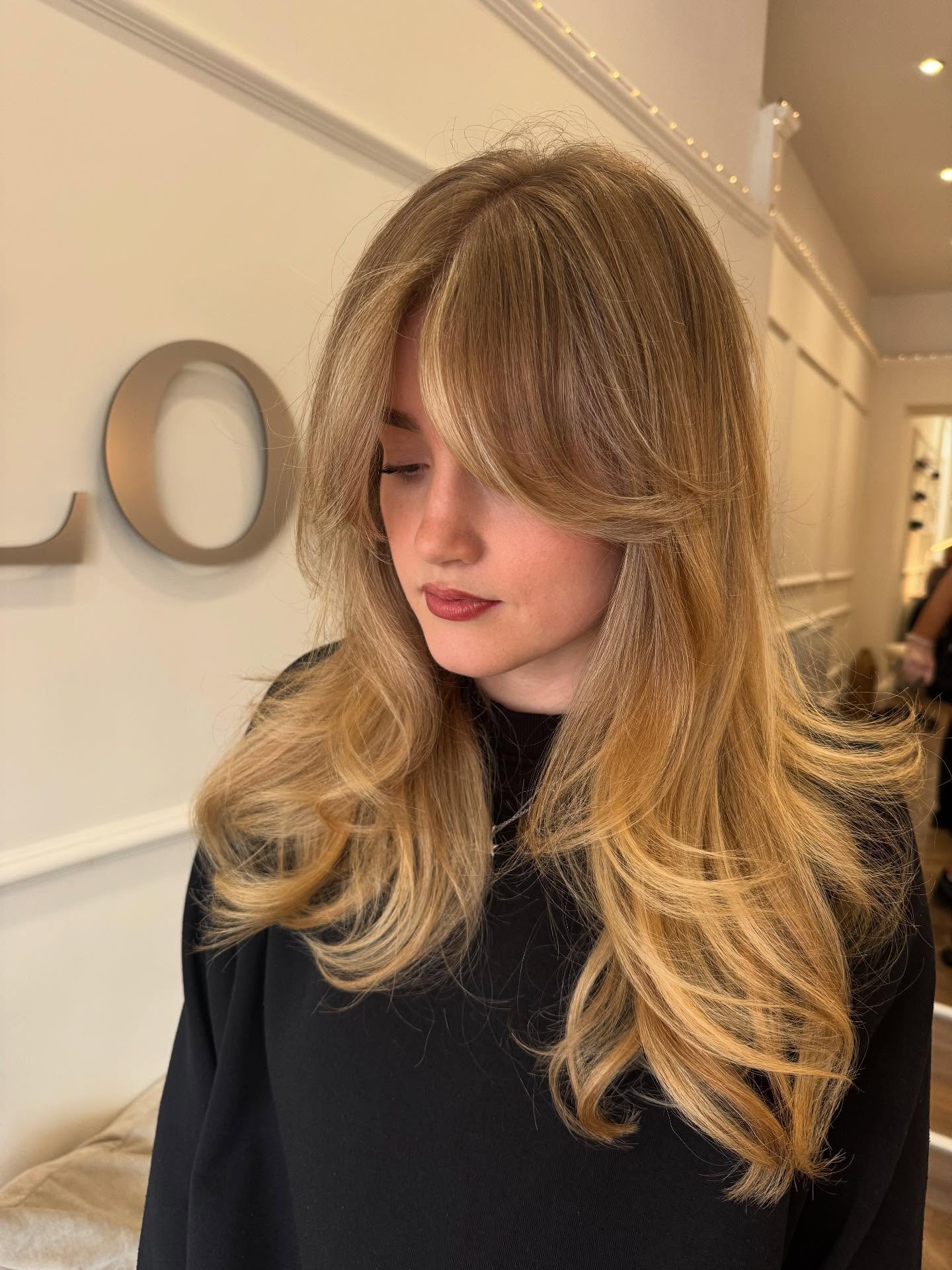 Softly Tousled Blonde Layers with Feathered Bangs