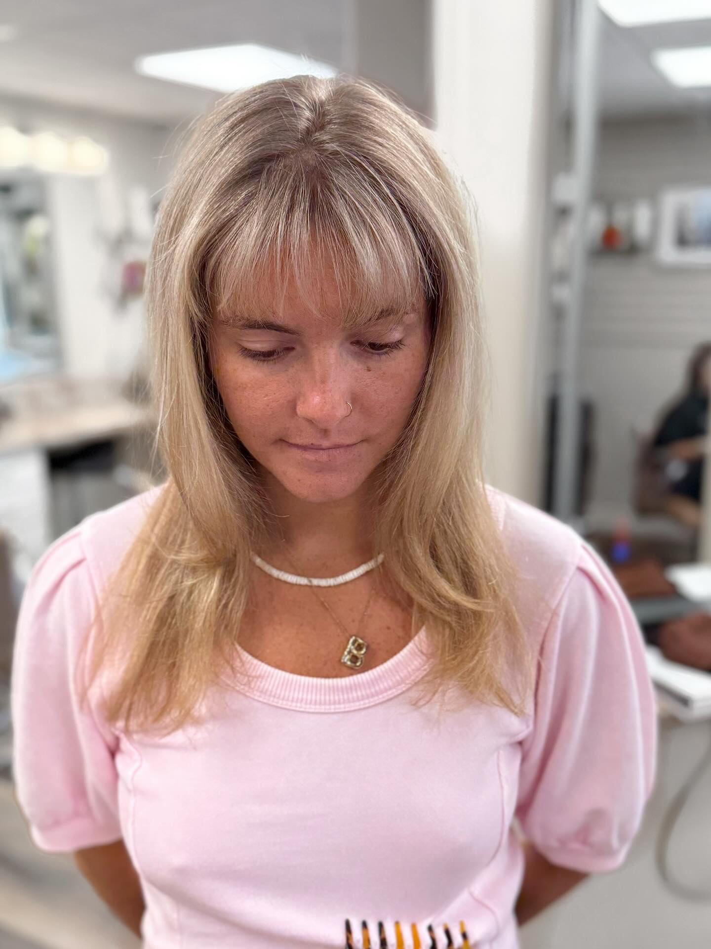 Subtle Blonde Curtain Bangs with Mid-Length Layers