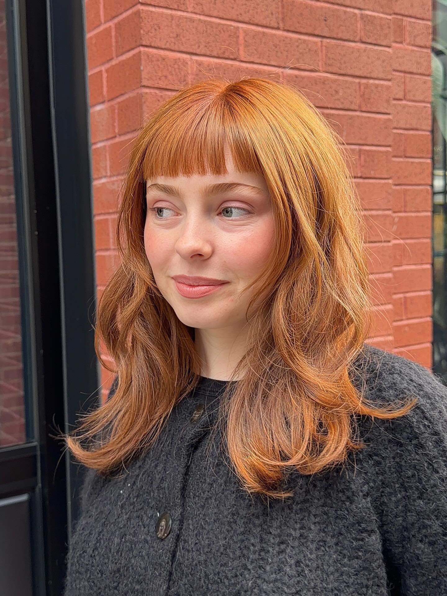 Textured Mid-Length Hair with Curtain Bangs