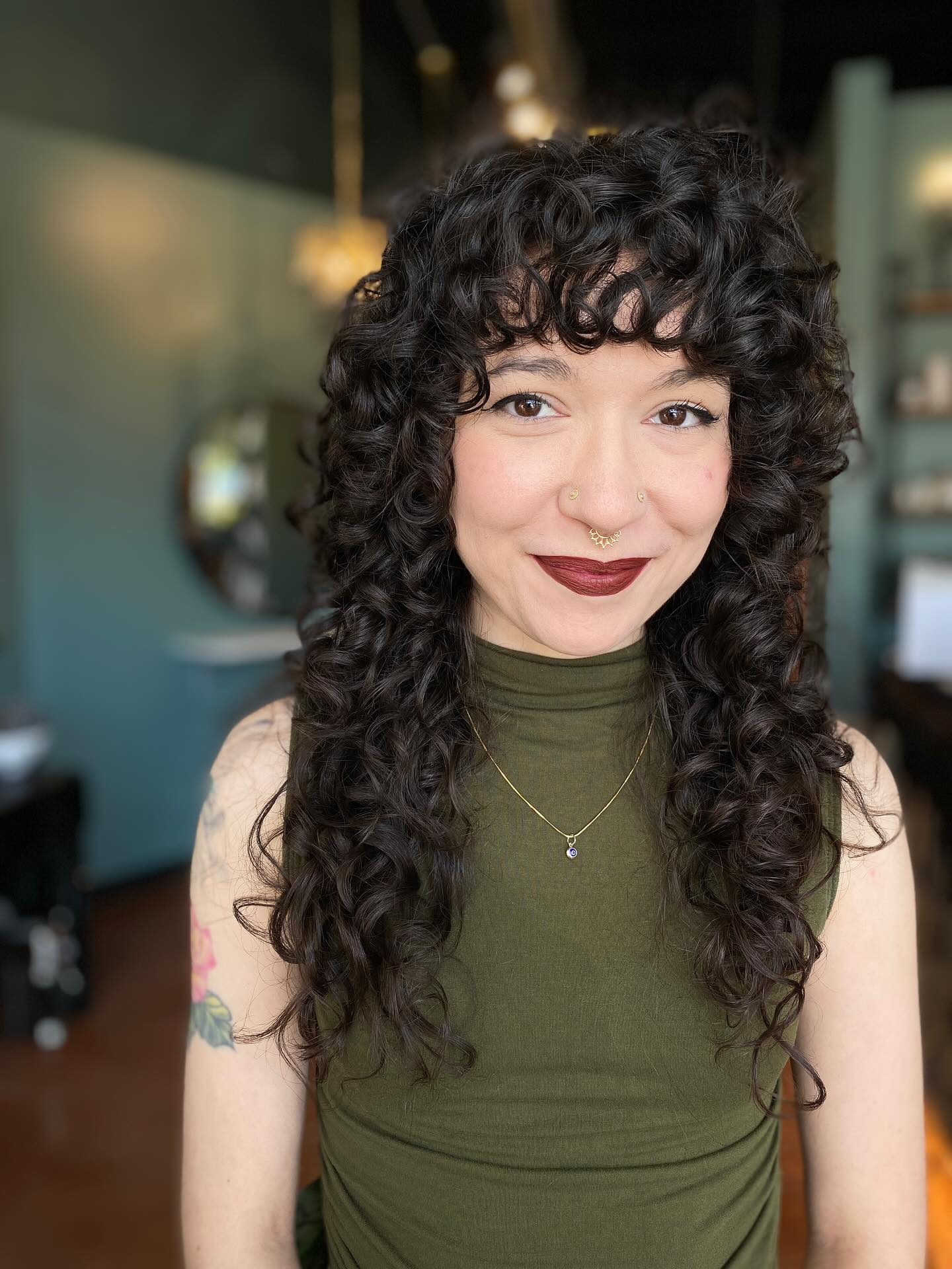 Cascading Dark Curls with Voluminous Bangs