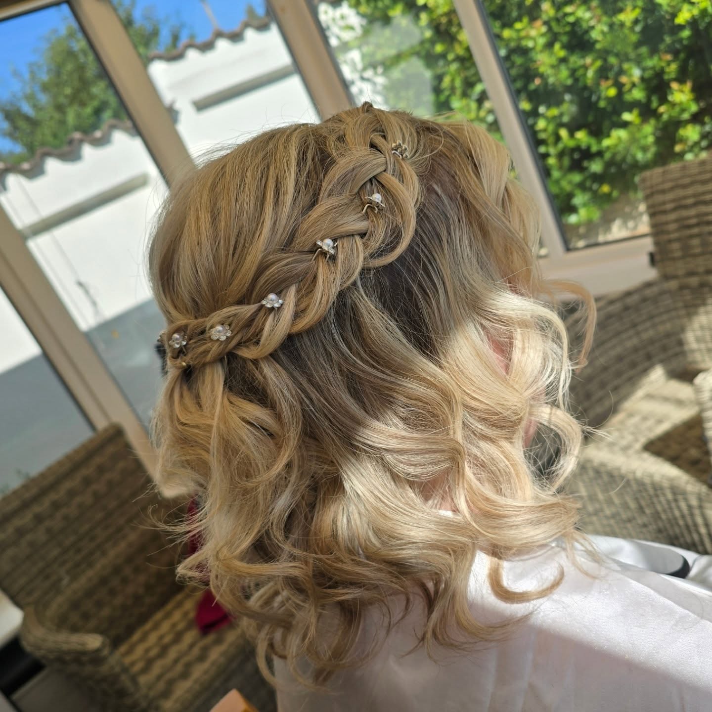 Cascading Golden Curls with Delicate Braided Accents