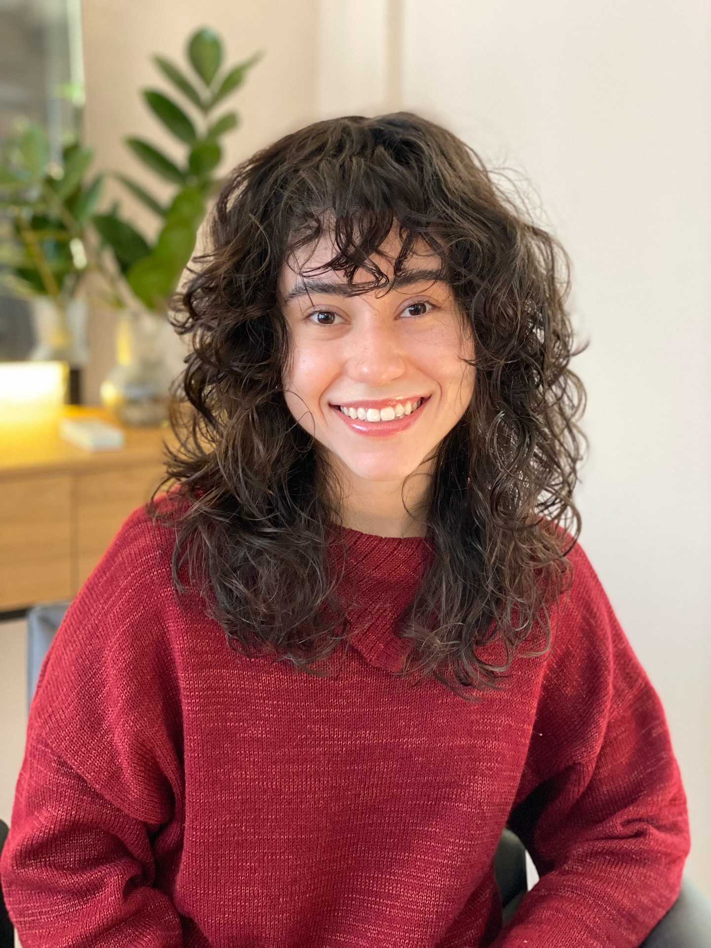 Chic Textured Mid-Length Curls with Soft Bangs