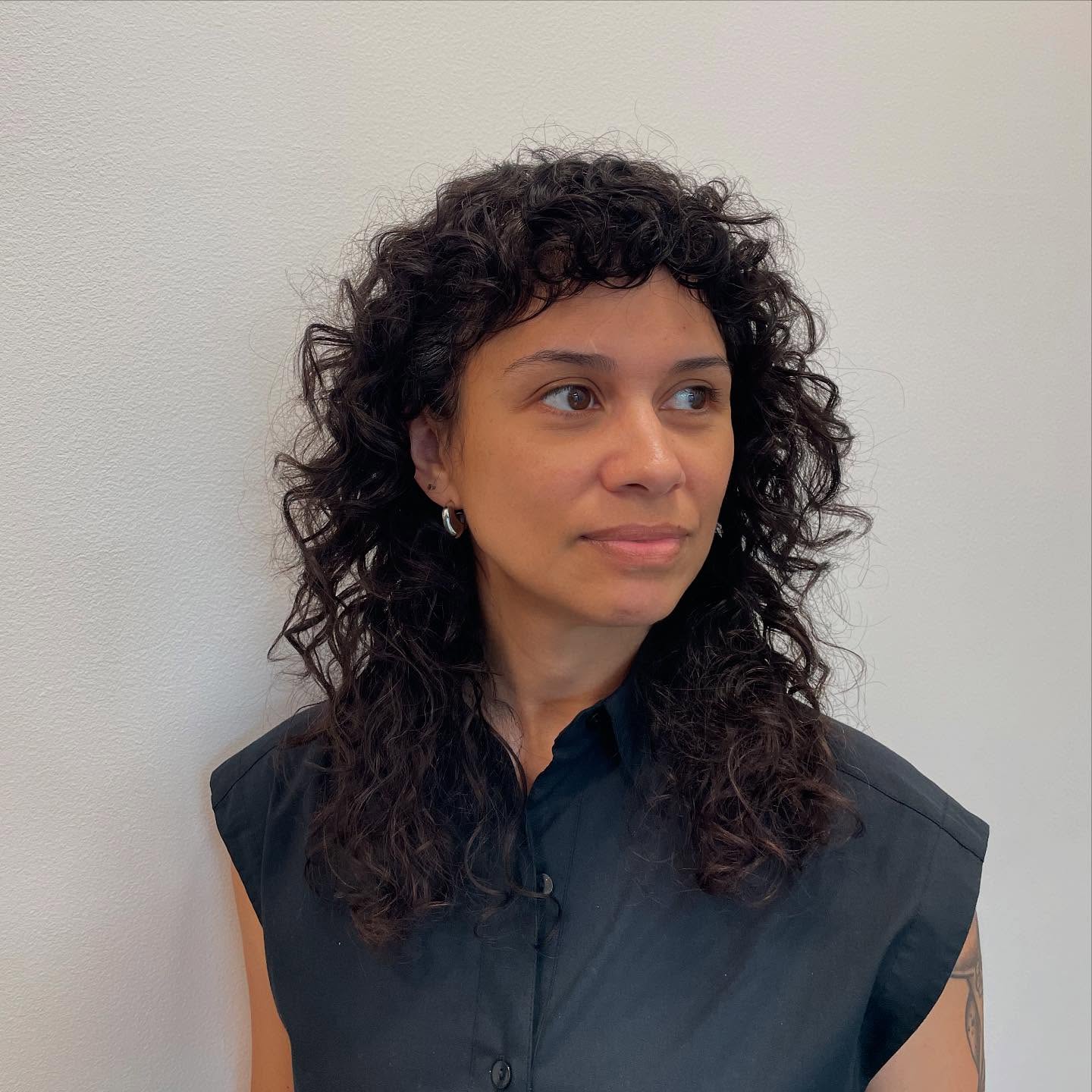 Modern Curly Shag with Soft Bangs