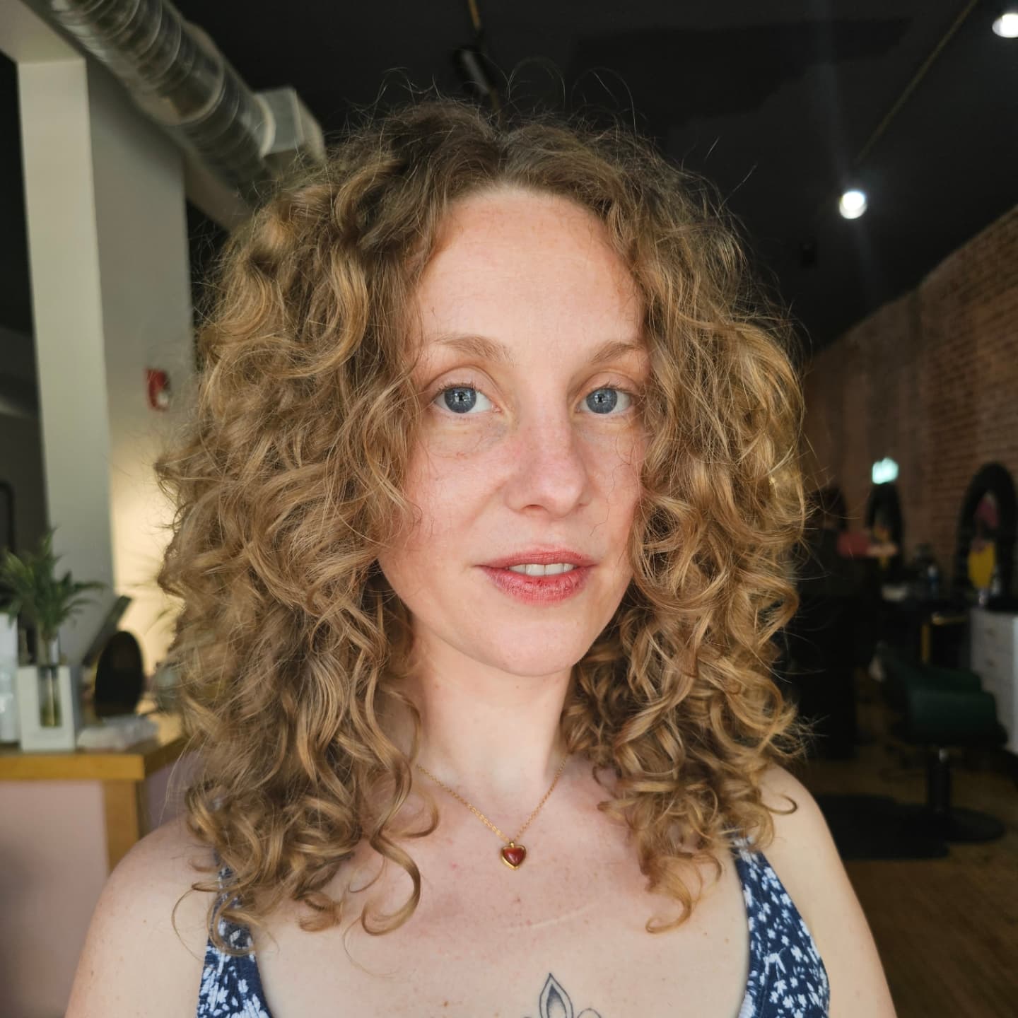 Natural Corkscrew Curls with Subtle Highlights
