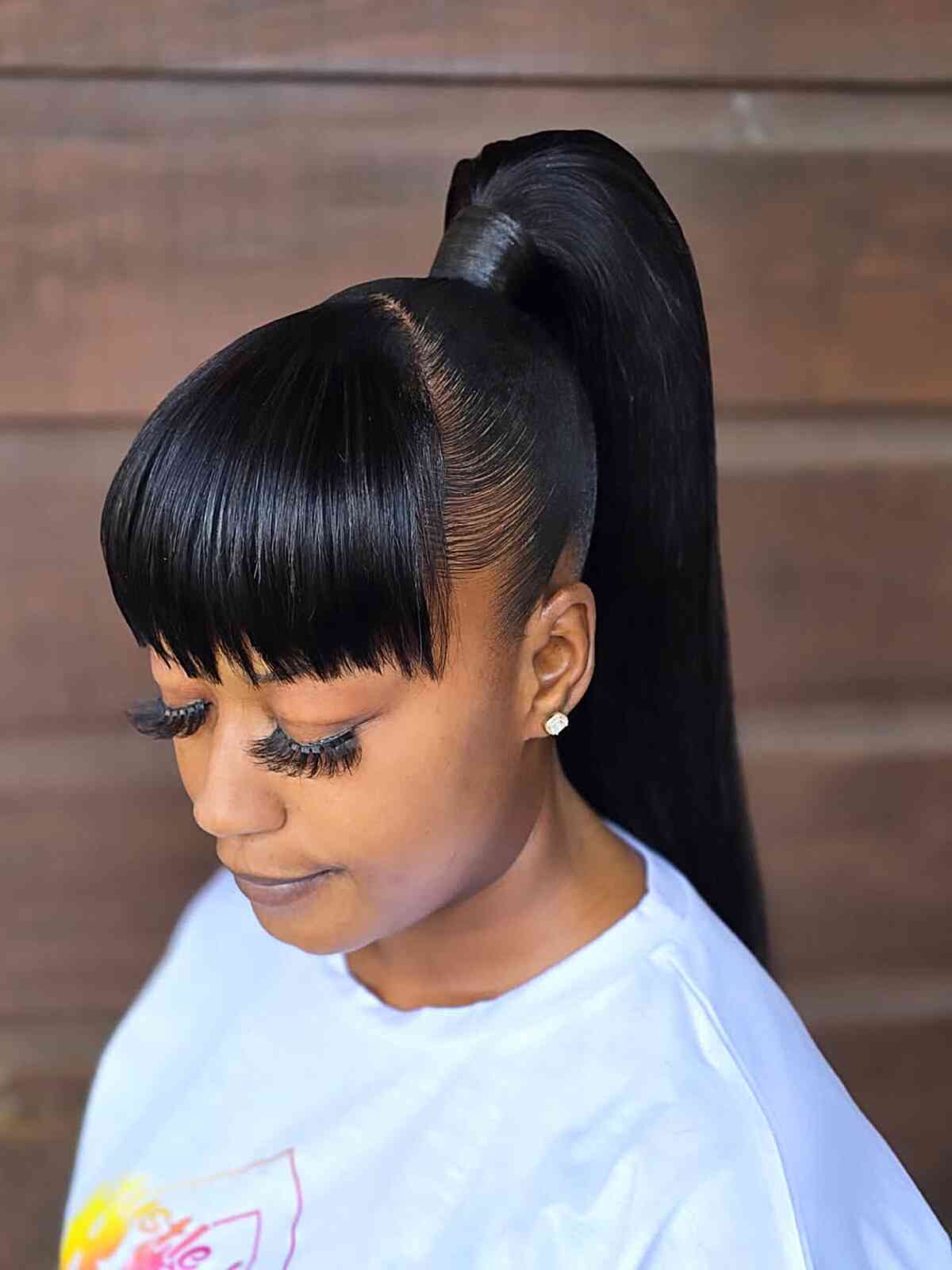Sleek High Ponytail with Bangs