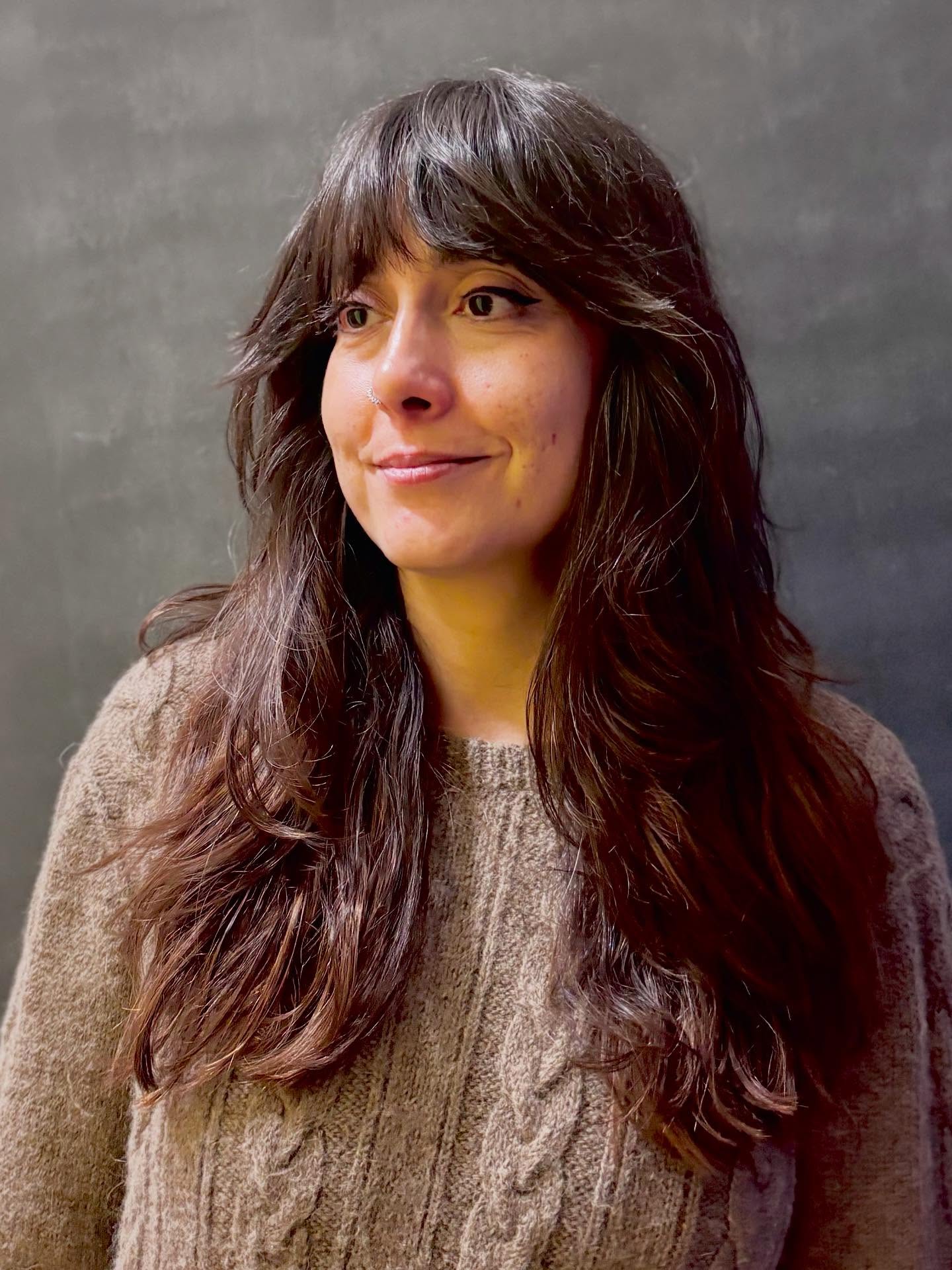 Softly Tousled Chestnut Layers with Wispy Fringe