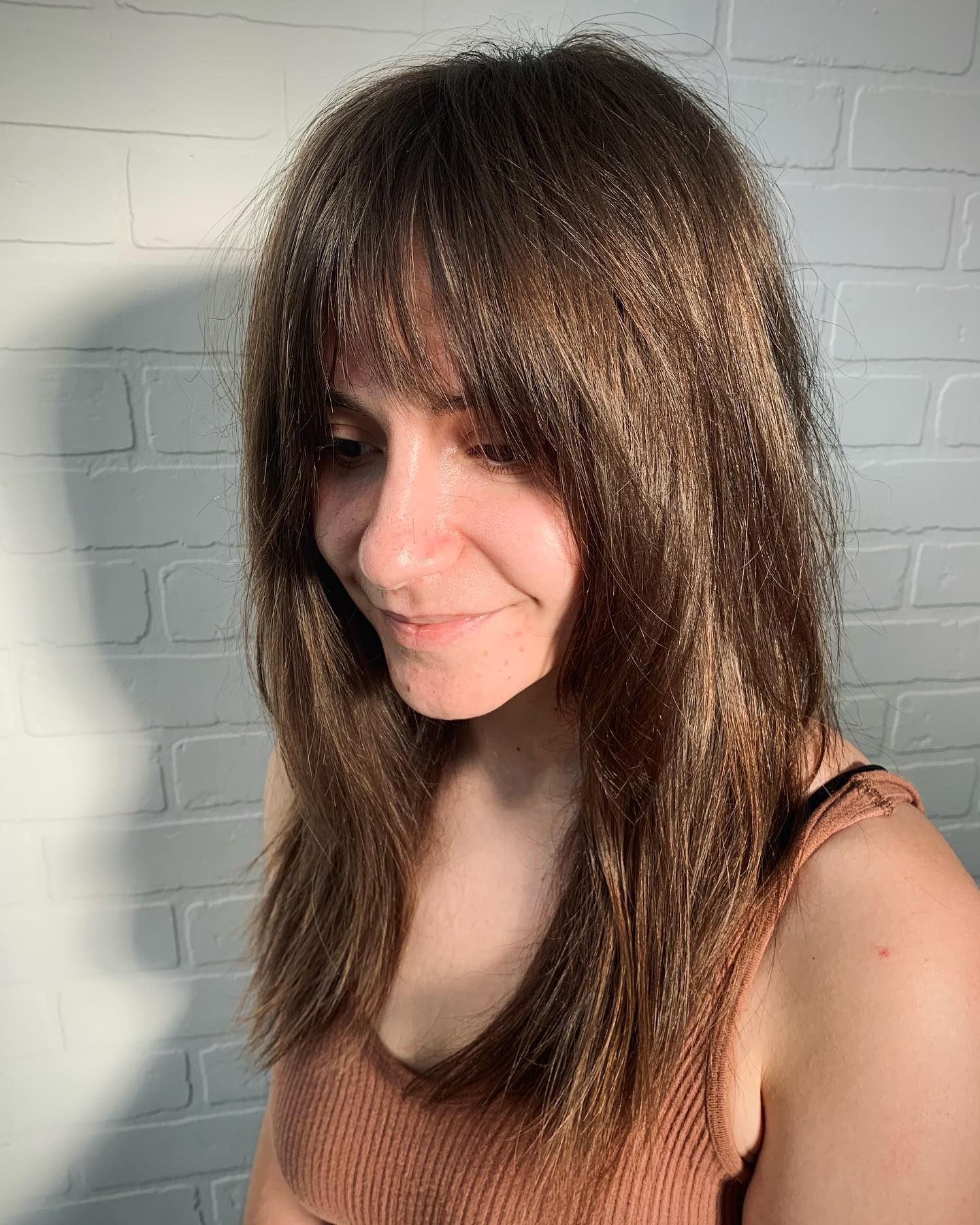 Textured Long Layers with Wispy Bangs